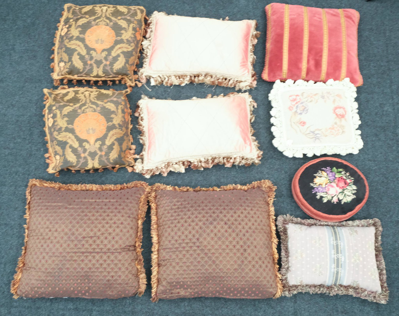 Large Lot of Vintage Decorative Throw Pillows: Upholstered in a variety of fabrics and executed in a variety of styles, some with tassels.
