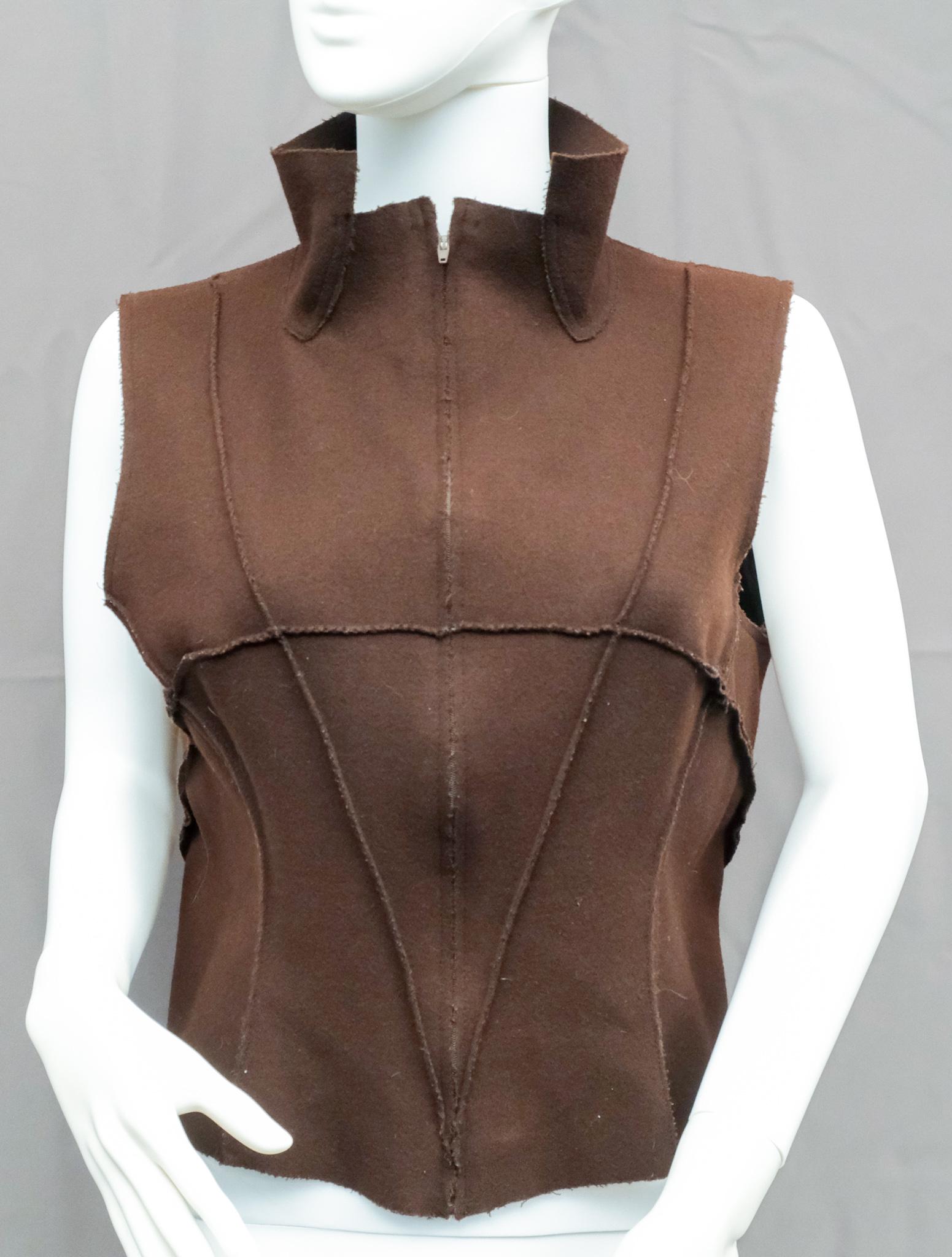(Hi)story by Vilma Mare Vest and Wristlets: Zip-up vest together with a pair of black wristlets.
