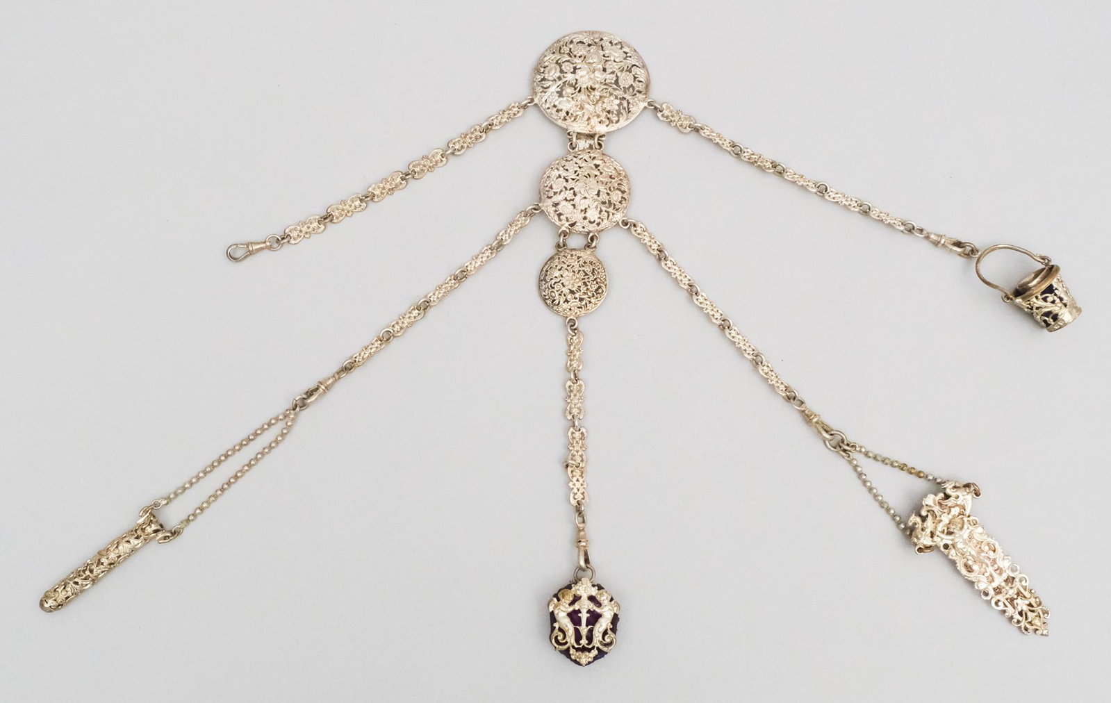 Antique Silverplate Victorian Chatelaine: With figural decoration and piercing. With various tools. Measures 3" X 13".