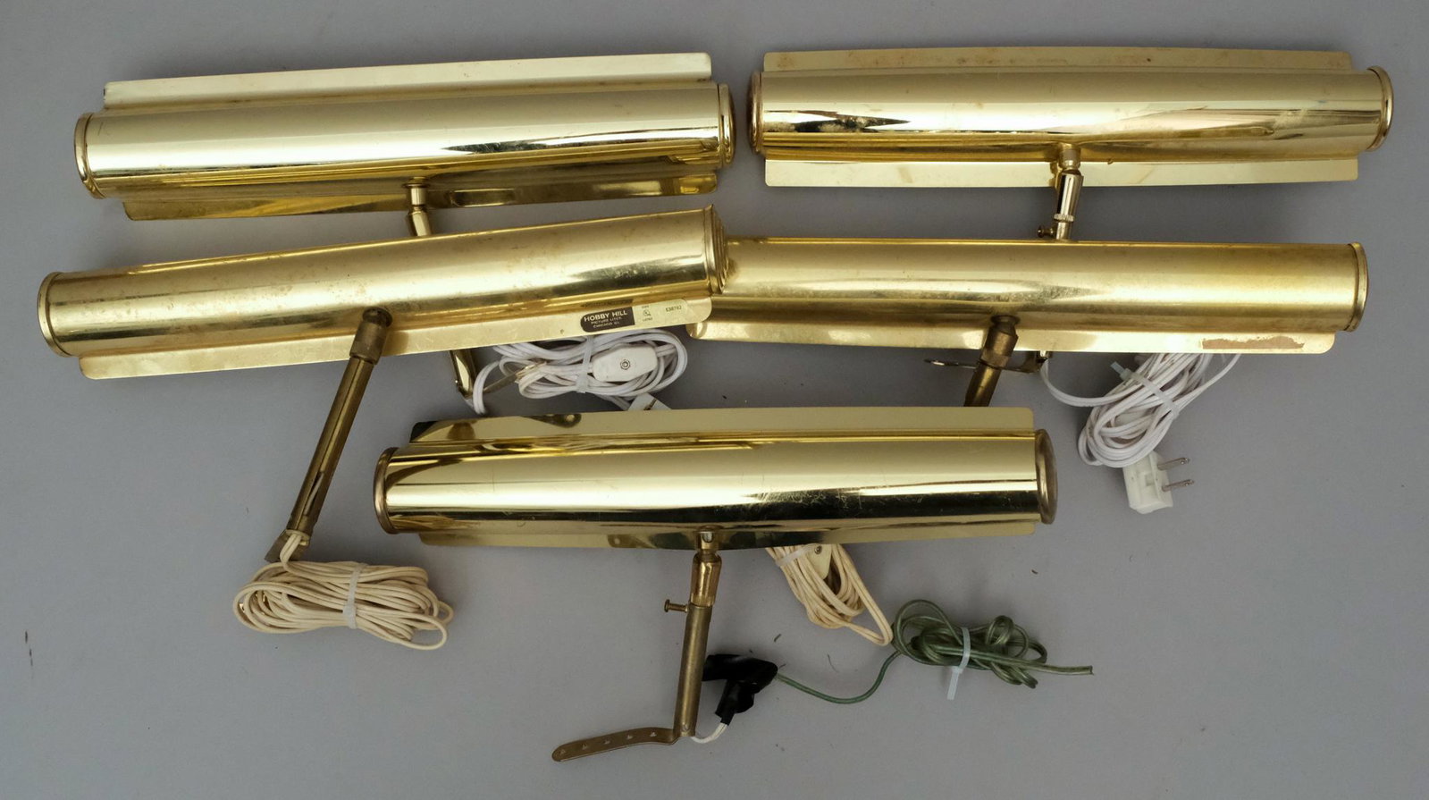 Five Large Frame Mounted Painting Lights 13 1/2" L: Brass finish, two bulb capacity, attached mounts, one light marked "Hobby Hill Picture Lites". Measuring: 13 1/2" long.