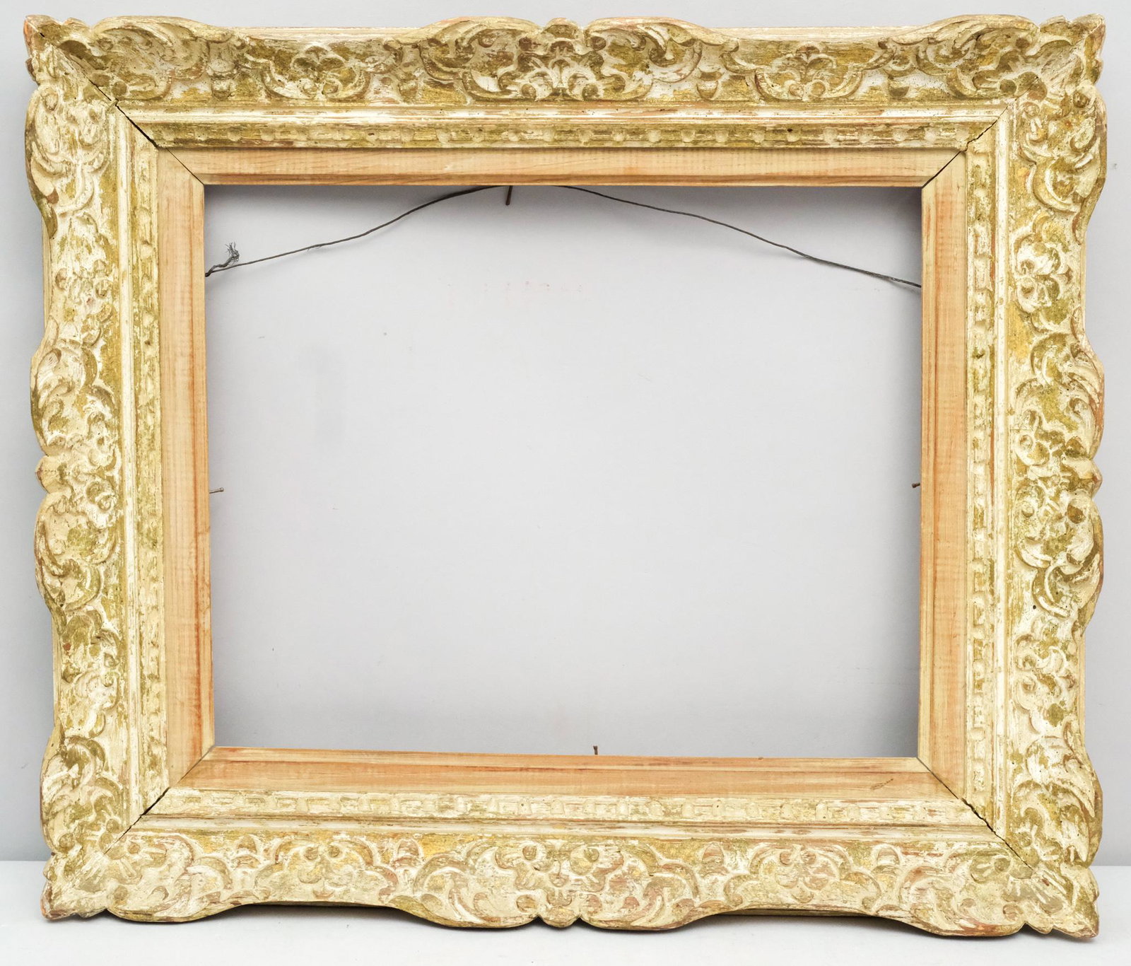 Louis XIV Style Montparnasse Frame: French, ca. 1930, hand carved and polychromed. One of a pair with Lot #XXXX. Rabbet: 13" X 16" Overall Dimensions: 19 1/2" X 23" Molding Width: 3 1/2"
