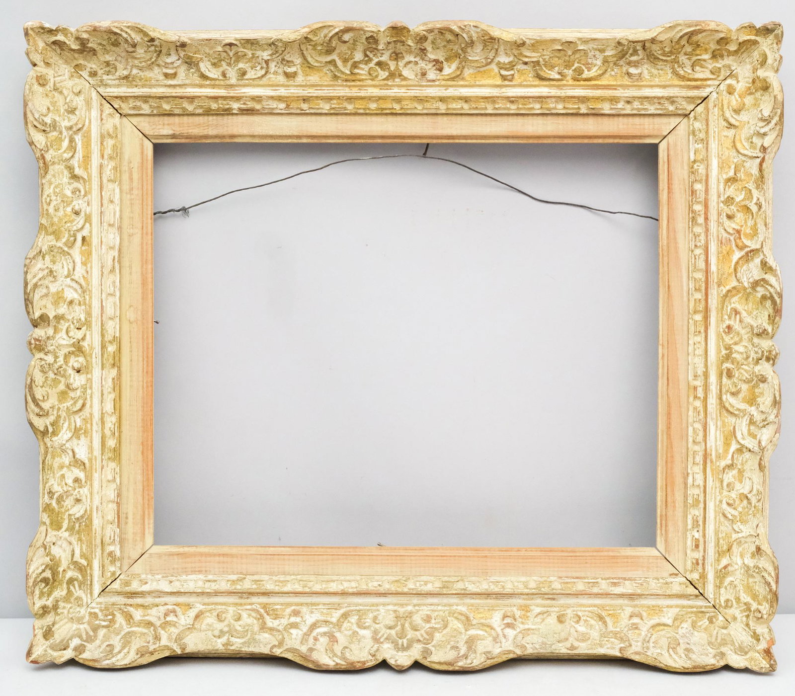 Louis XIV Style Montparnasse Frame: French, ca. 1930, hand carved and polychromed. One of a pair with Lot #XXXX. Rabbet: 13" X 16" Overall Dimensions: 19 1/2" X 22 3/4" Molding Width: 3 1/2"