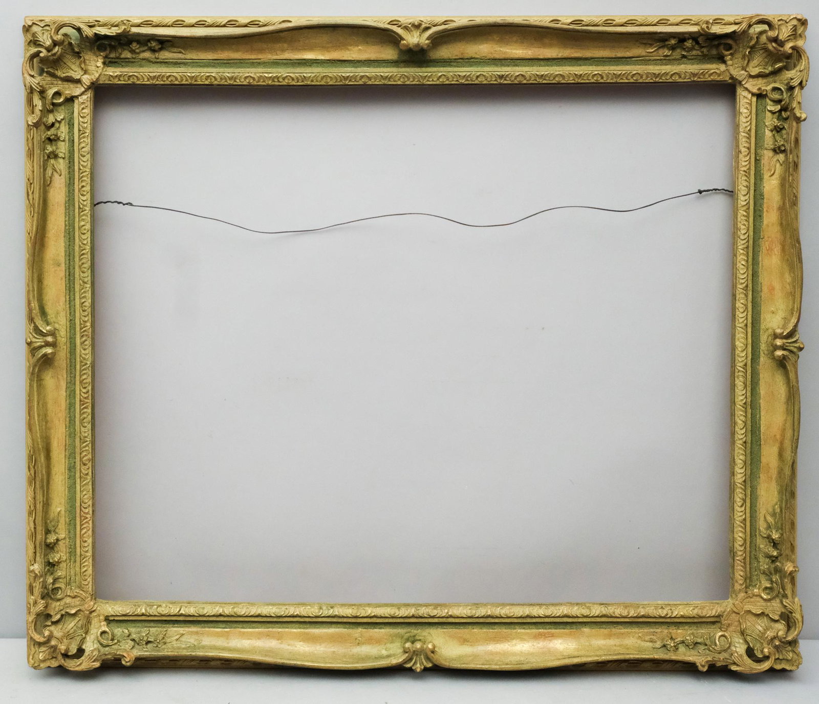 Louis XV Style Montparnasse Frame: French, ca. 1930, hand carved original painted and antiqued surface. Rabbet 32" X 26". Overall: 37 7/8" X 32". Molding: 3 1/2".