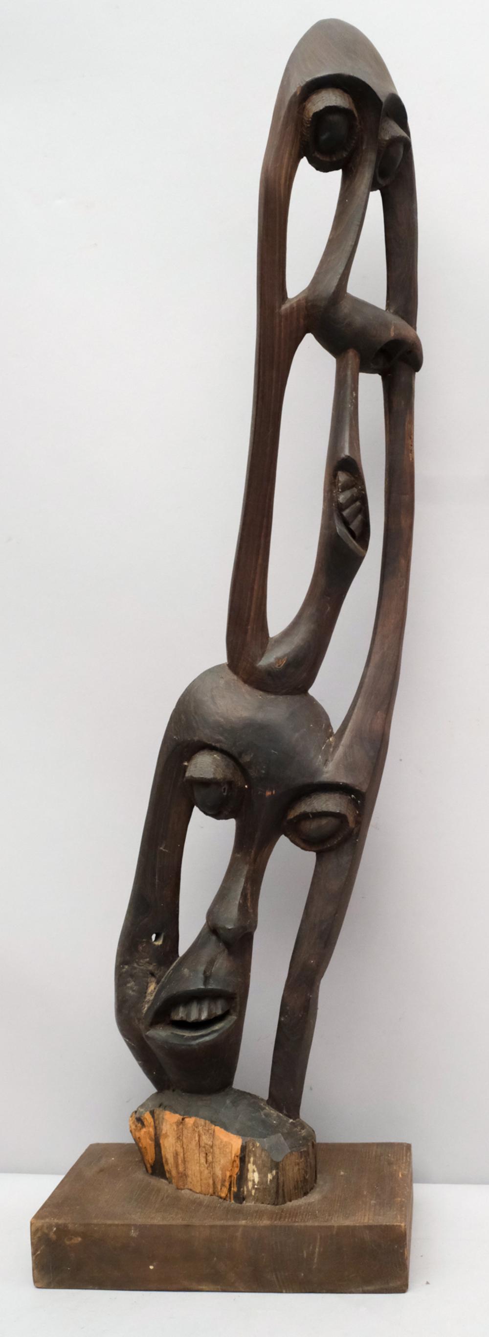 Abstract Wooden Carving of Twisting Faces: In a cubist manner. Breathtakingly bizarre and unsigned. 31 1/2" tall.
