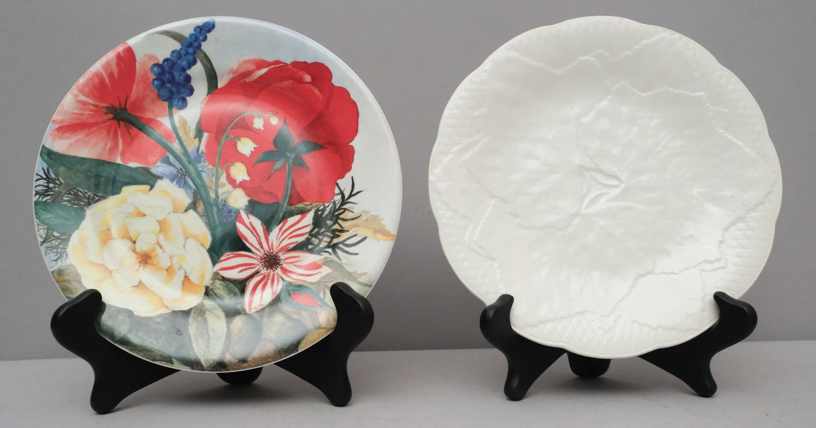 2 Sets of Faiencerie De Gien Plates: Comprising a set of 8 salad plates in the "Volupte" pattern and a set of 7 dessert plates embossed with leaves. 8 1/2" and 8 3/4" in diameter. Marked as shown