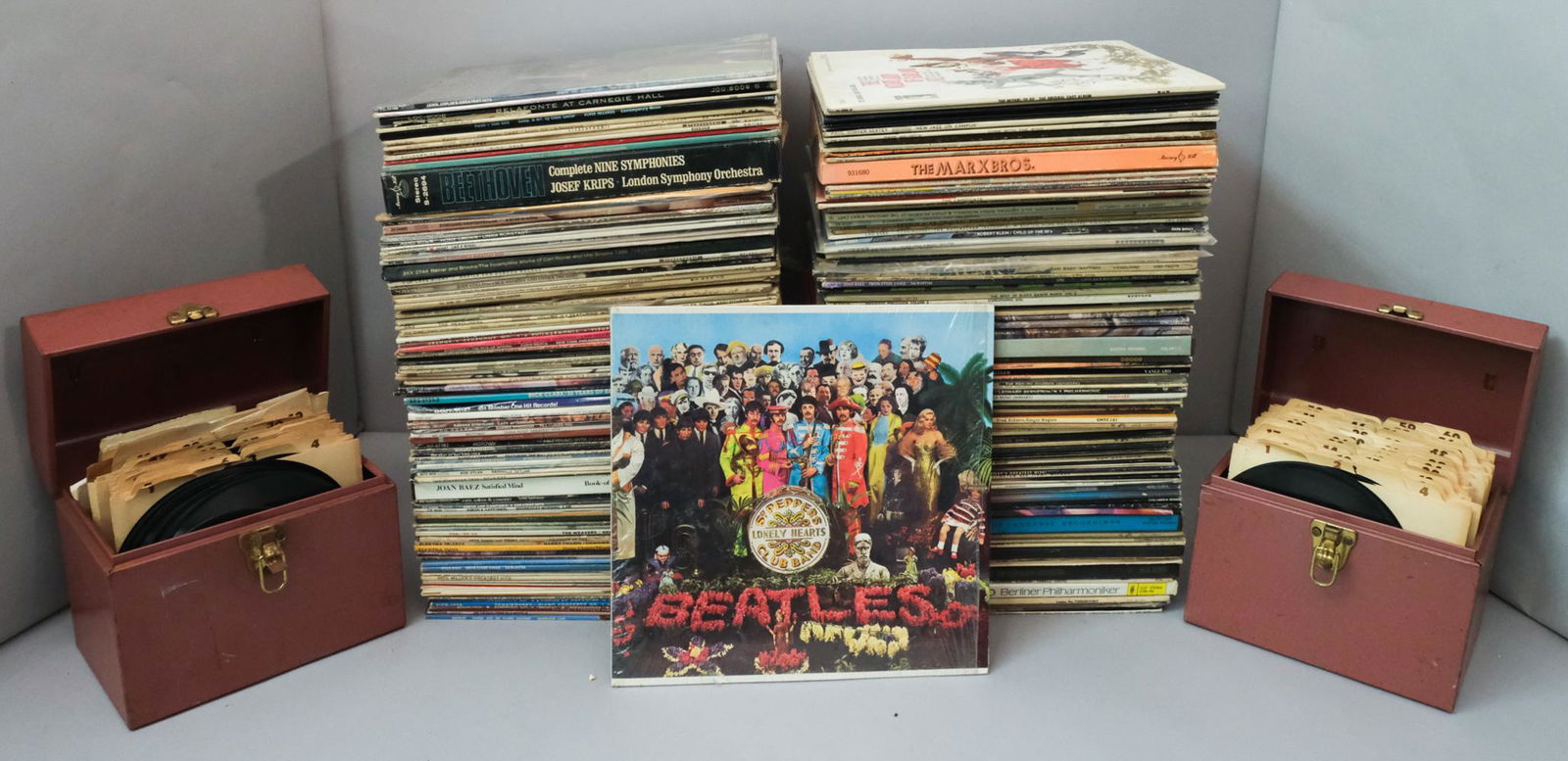 Four Boxes of Records: Four boxes of records, including such names as Dr.John, Earl Coleman, the Bill Evans Trio, and Paul Simon. Both 45's and 78's, many hidden gems!