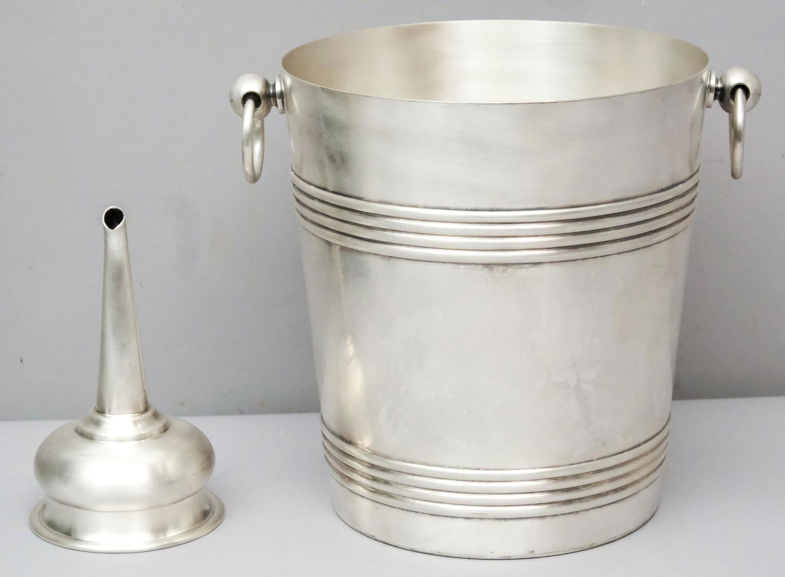 Christofle Silverplate Ice Bucket & Wine Funnel: Comprising a champagne or ice bucket with banded decoration, and a large wine funnel. 6" and 8 1/4". Marked as shown.