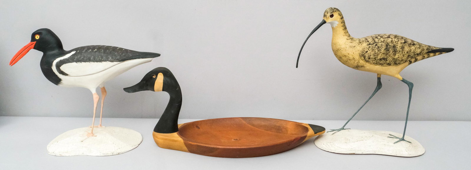 Lot of 2 signed McCarthy decoys, 1 GRT goose: Including 1 wood carved decoy of an American Oyster Catcher signed Michael R. McCarthy and 1 wood carved decoy of a Long-Billed Curlew also signed Michael R. McCarthy. Both Decoys are signed and dated