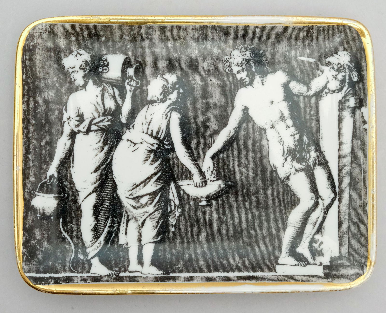 Small Fornasetti Italy Porcelain Tray: With iconic black and white neoclassical decoration with gold trim. Marked as shown. 4 3/8" x 5 5/8".