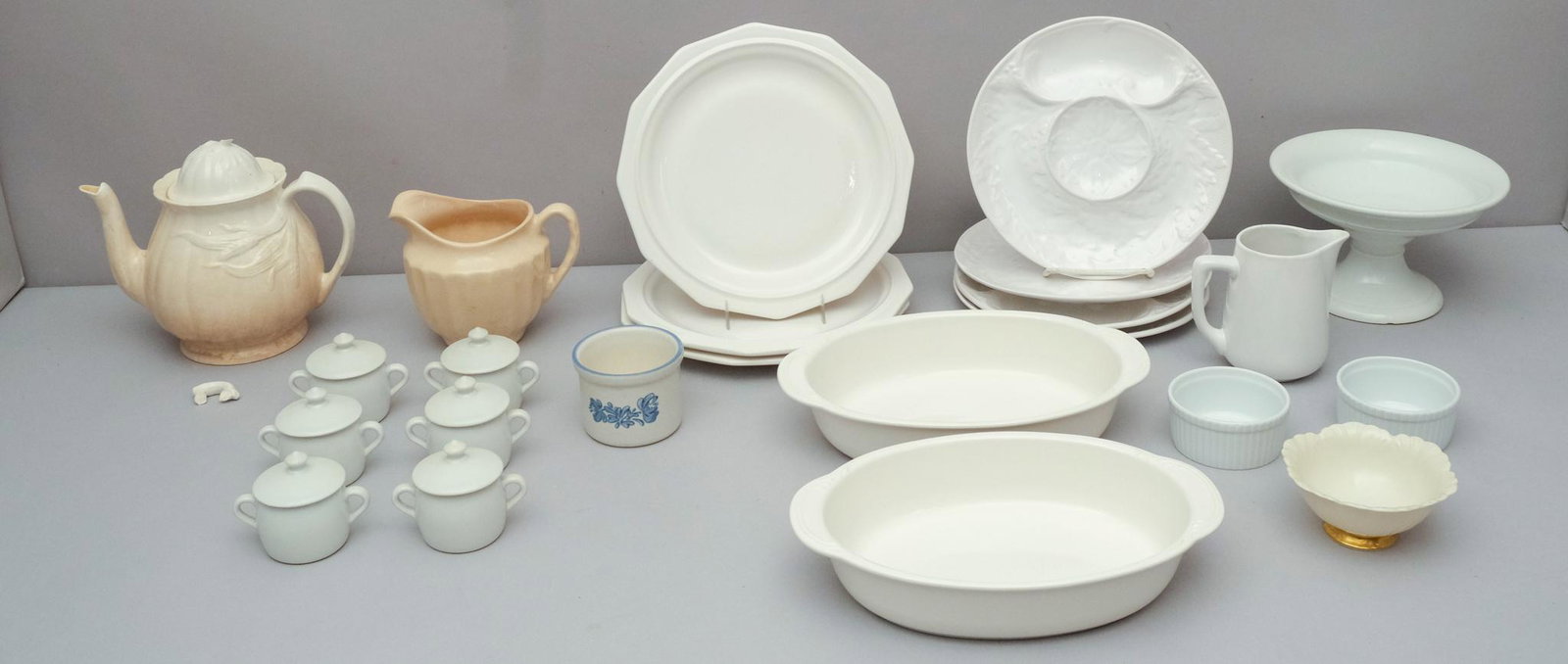Large Lot of White Porcelain: Comprising various form, figures, and makers. Largest piece is 11 1/2" casserole dish, smallest 2" creamer.