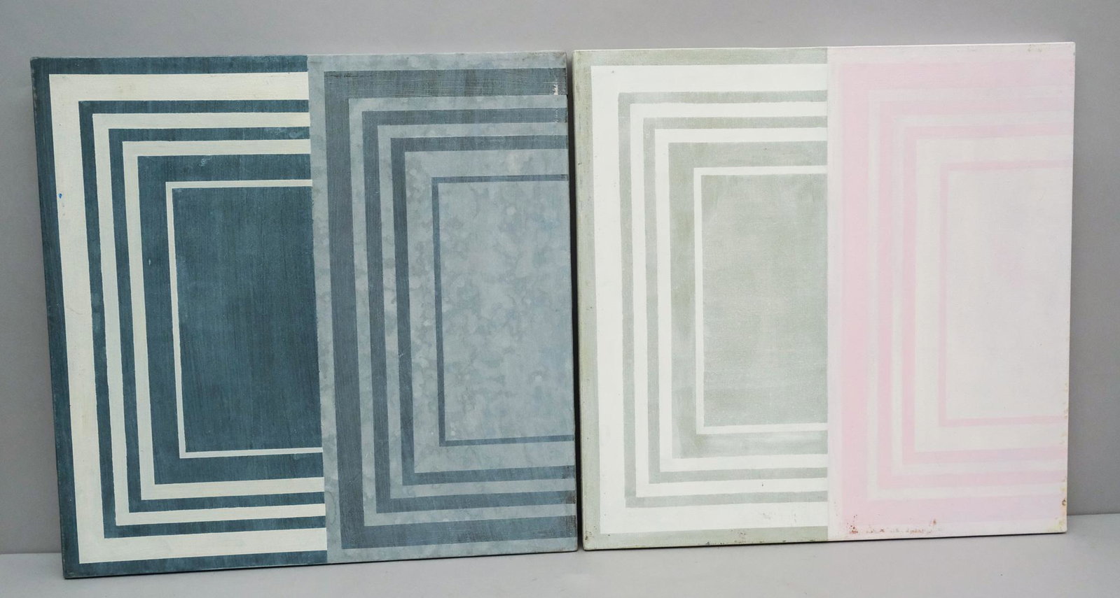 Pair of Two-Tone Minimalist Art: American, 20th century modernist, minimalist oil on canvas composed of blocks and lines of color, one is half gray and half blue, the other is pink and off-white, 20" x 20" overall.