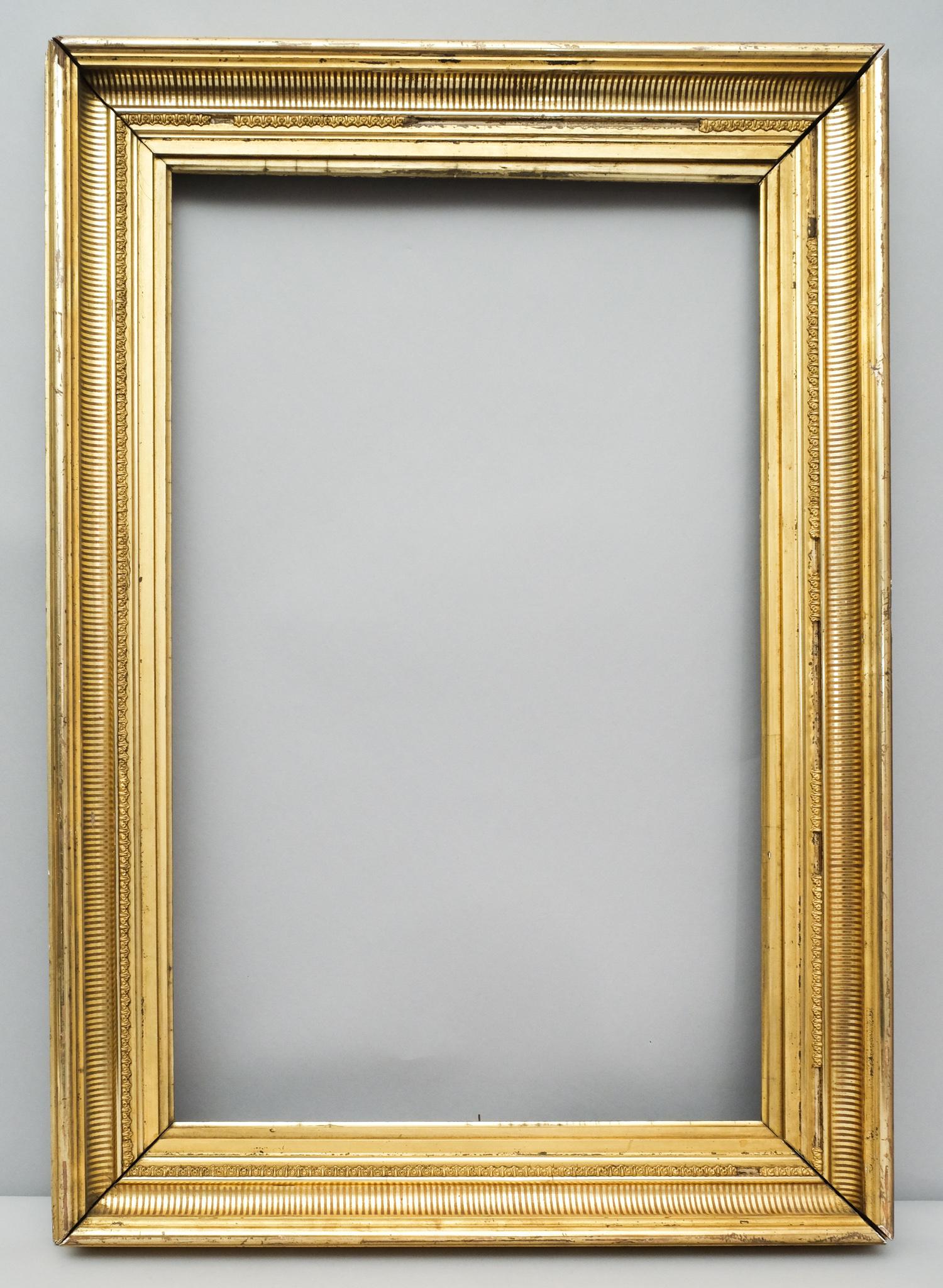 American Lemon Gold Stenciled Frame: American, ca. 1860, cove profile with fluted cove stencil decoration. Rabbet 16 1/2" X 26 1/2" overall 23 1/4" X 32 1/4" molding 3 1/2"