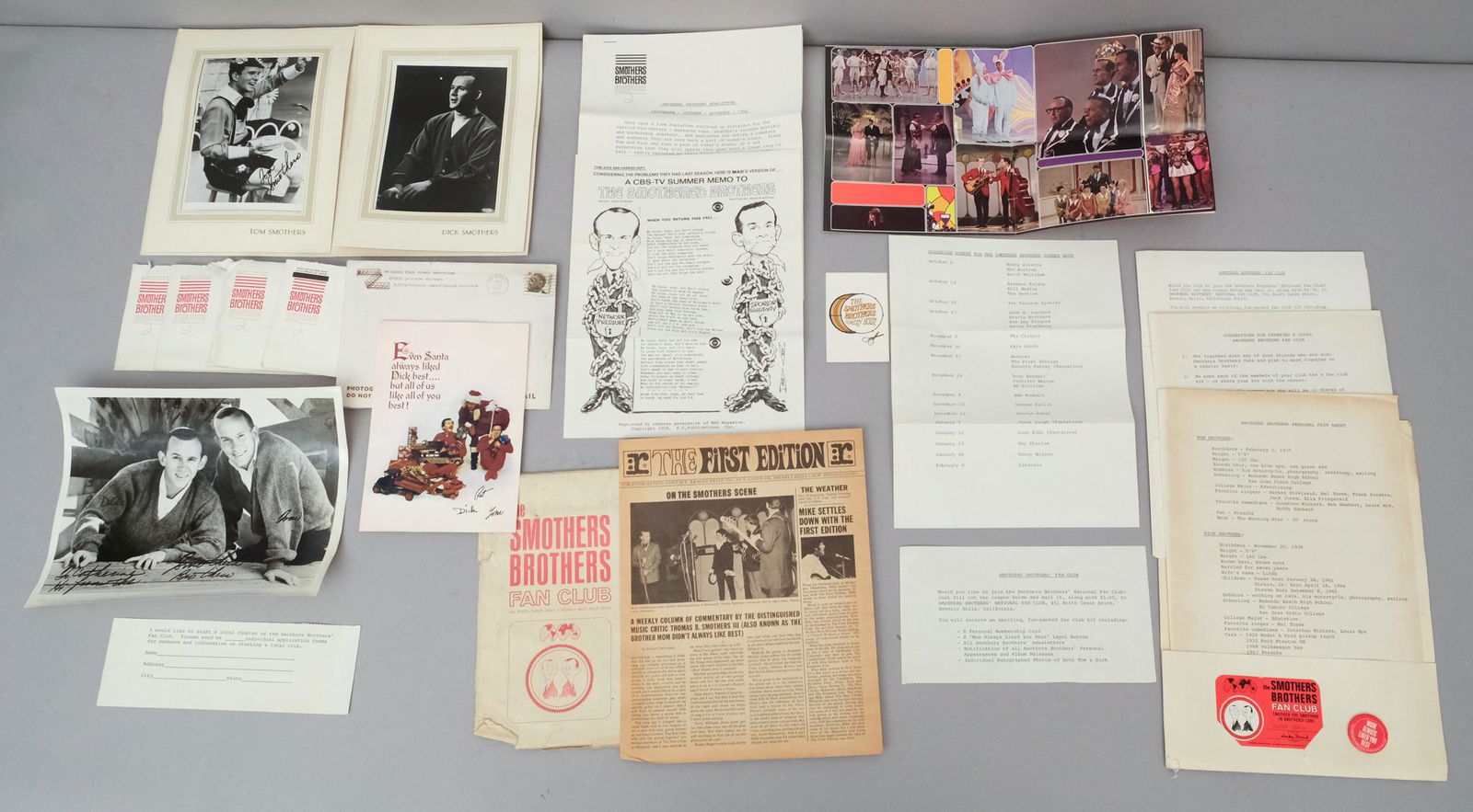 Lot of Antique Smother Brothers Ephemera & Photos: Consisting of multiple Smothers Brothers newsletters from the year 1968, multiple photographs with printed signatures, and other ephemera. Photos measure from 5" x 7" - 8" x 10".