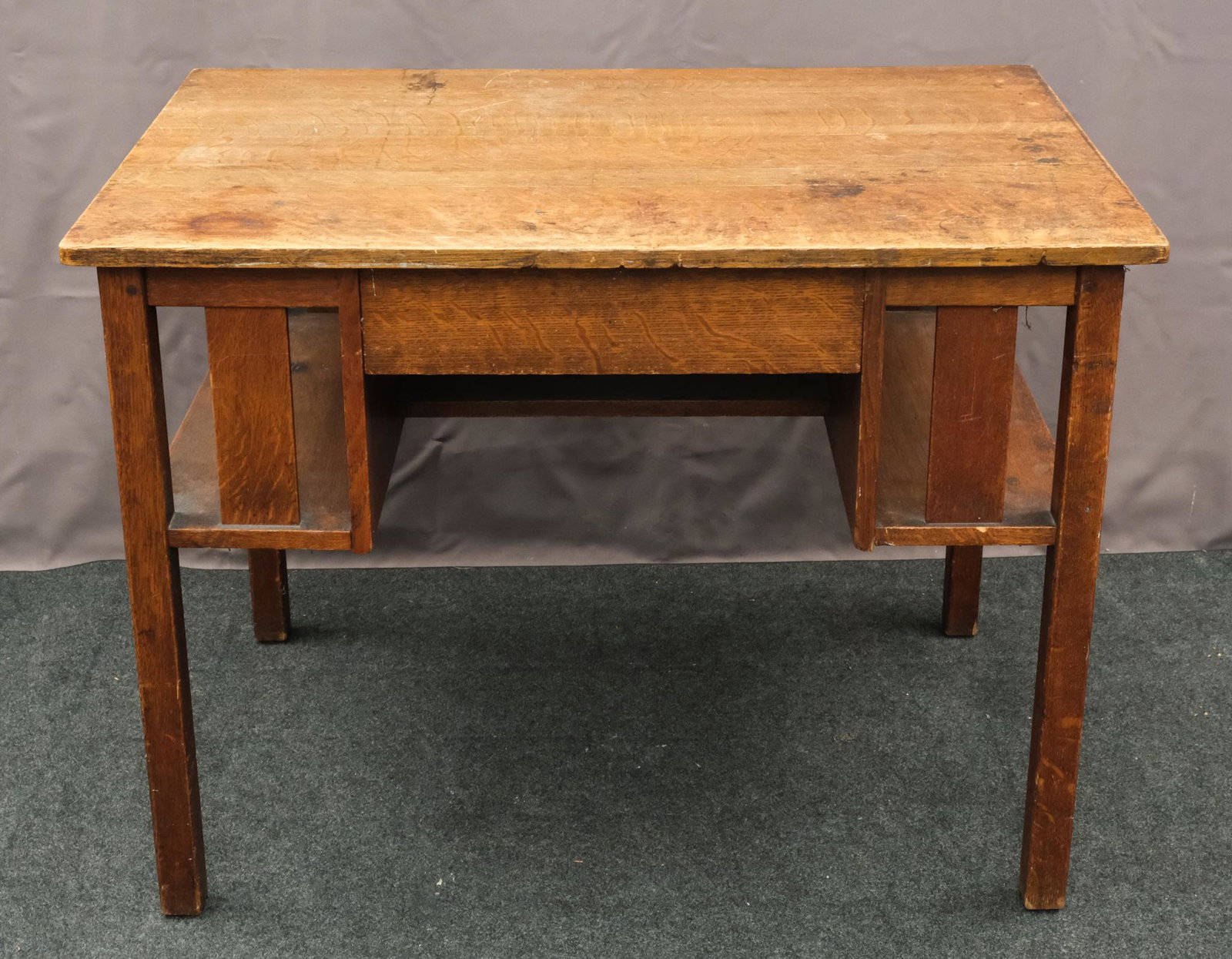 L & J.G. Stickley Arts & Crafts Desk: American, 20th century oak desk with a built-in bookshelf on either side, a drawer at center, and square legs, 30" H x 40" W x 26" L. Marked on interior of drawer.
