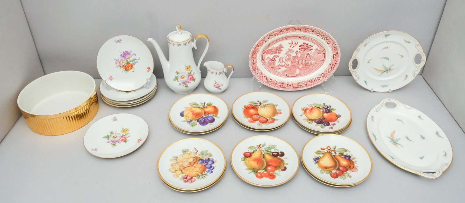 Lot of German & English Porcelain: Alboth & Kaiser coffee pot, creamer and six floral motif plates, Mitterteich 12 plates in six different fruit patterns (2 of each), 2 unmarked fern pattern, gilded edged serving plates, one Alfred Mea