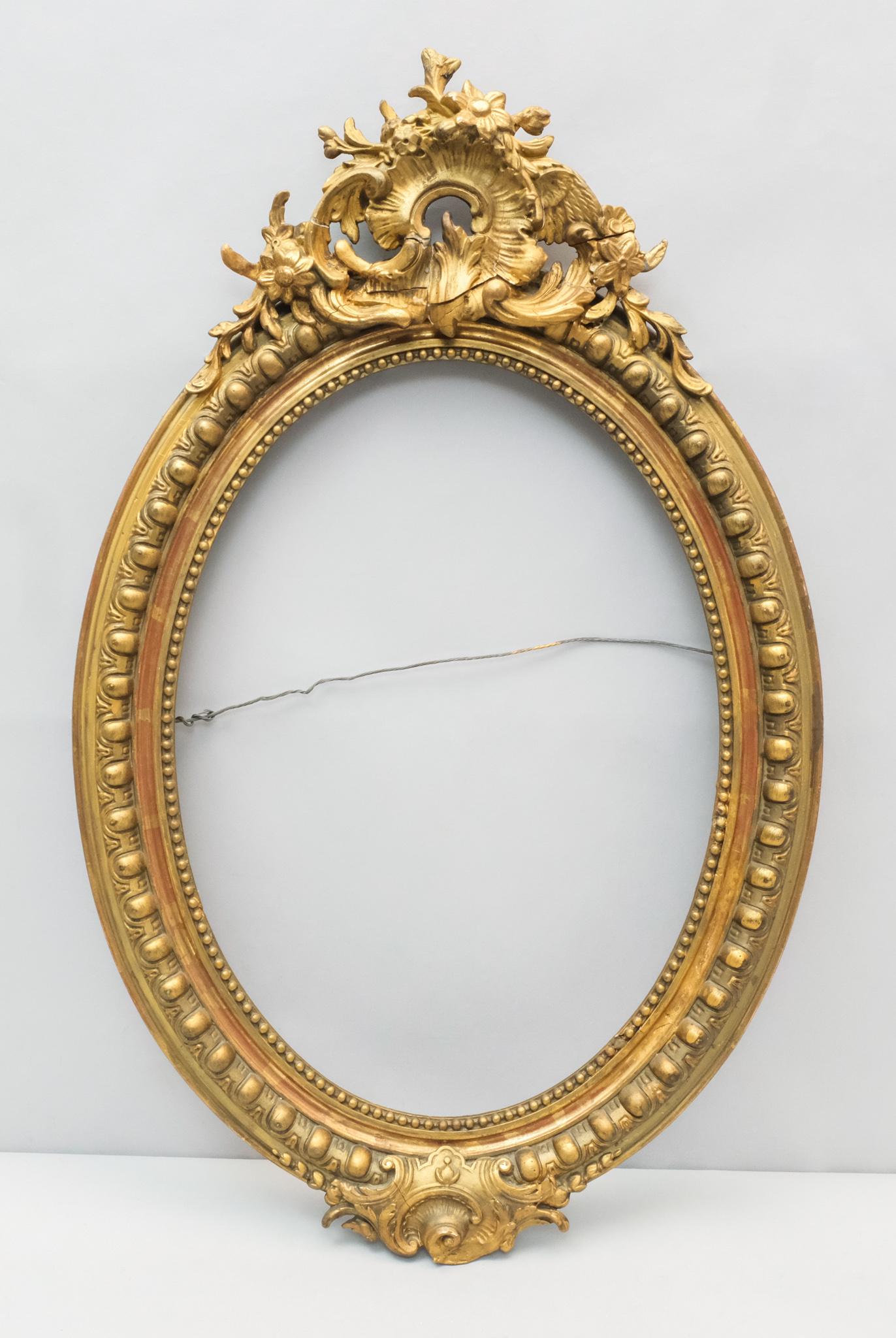 Louis Philippe Giltwood Oval Frame: French, 19th century, having baroque cartouche. O.D. 20 1/2" x 32" Rabbet 15" x 21" Molding 3"
