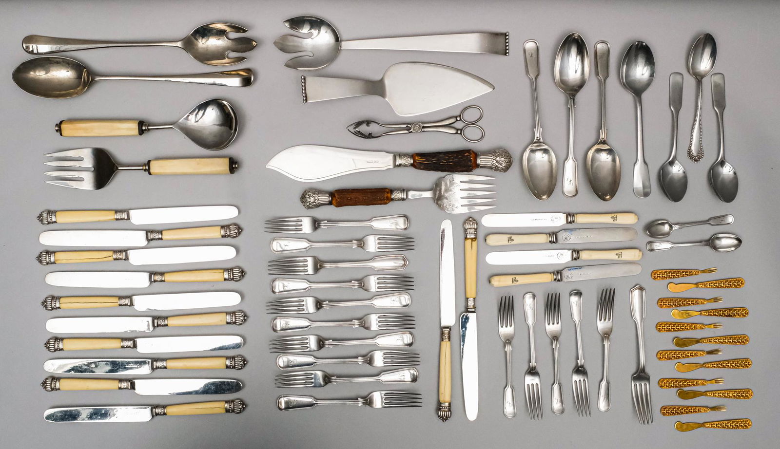 Lot of Antique Silverplate & Gilt Flatware: Including a partial set of thread pattern flatware by Mappin & Webb, a set of faux bone knives, a stag handled fish serving set.