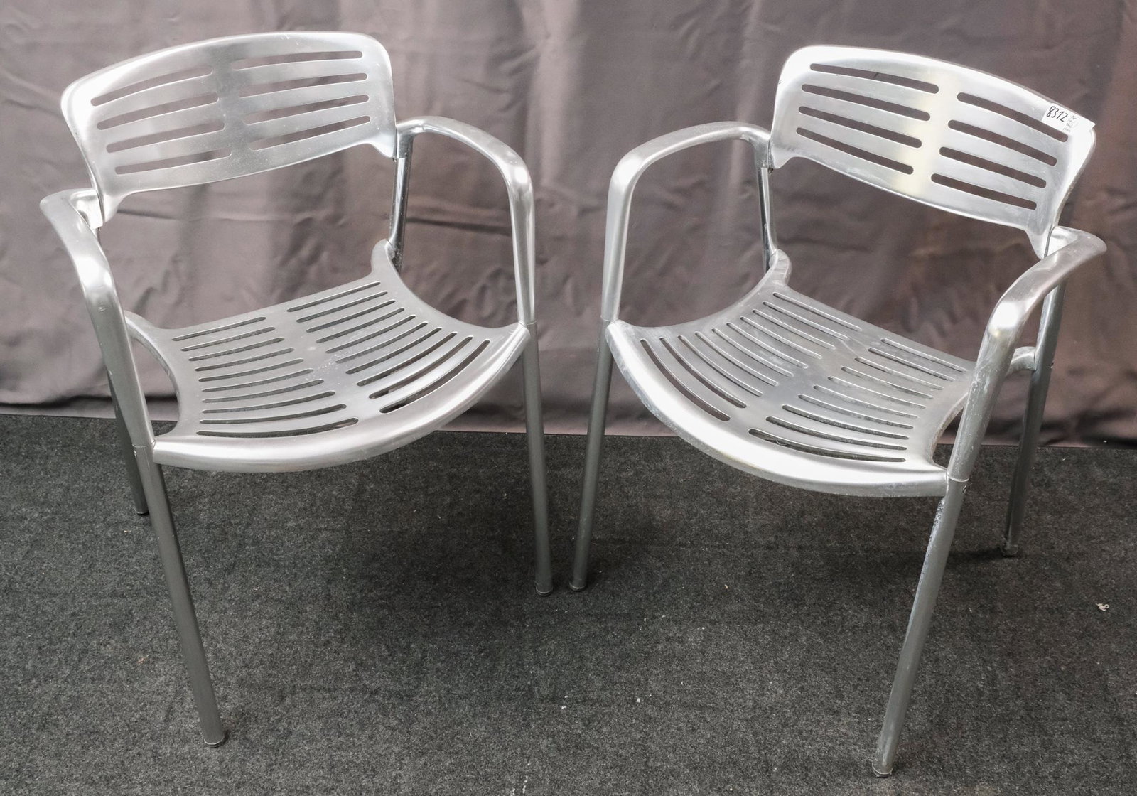 Pair of Jorge Pensi "Toledo" Chairs: Pair of Jorge Pensi for Amat (for Knoll) cast-aluminum "Toledo" stacking chairs, stamped "Toledo Design Jorge Pensi for Amat, Made in Spain" on the bottom, circa 1986, 30 1/2" H x 22" W x 21" D.