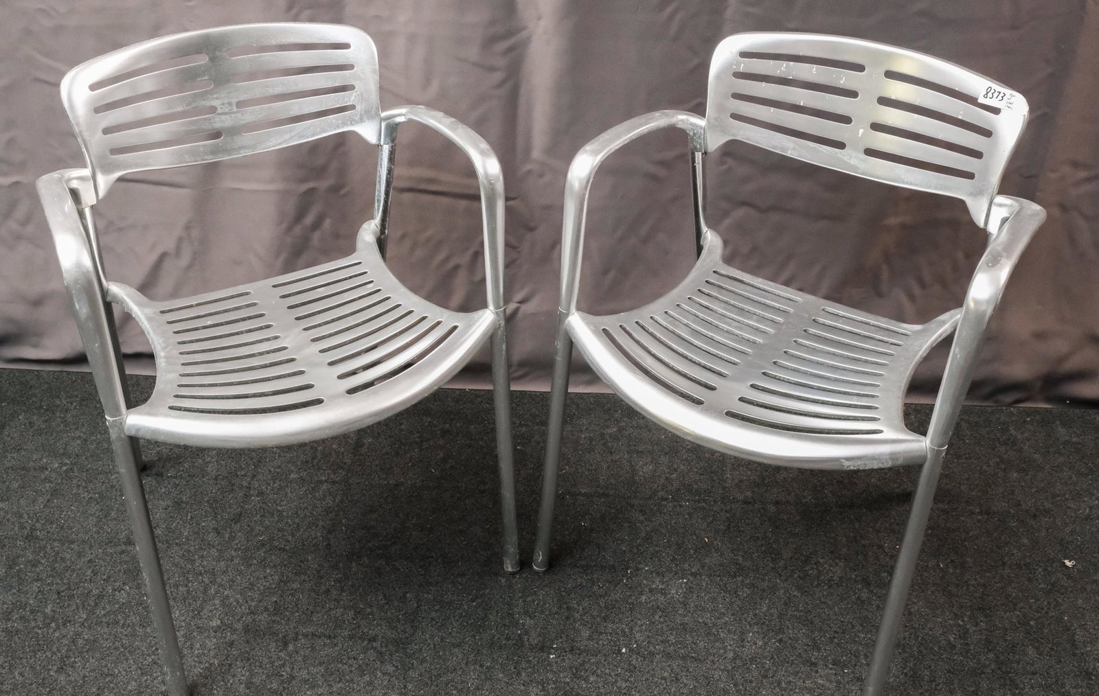 Pair of Jorge Pensi "Toledo" Chairs: Pair of Jorge Pensi for Amat (for Knoll) cast-aluminum "Toledo" stacking chairs, stamped "Toledo Design Jorge Pensi for Amat, Made in Spain" on the bottom, circa 1986, 30 1/2" H x 22" W x 21" D.
