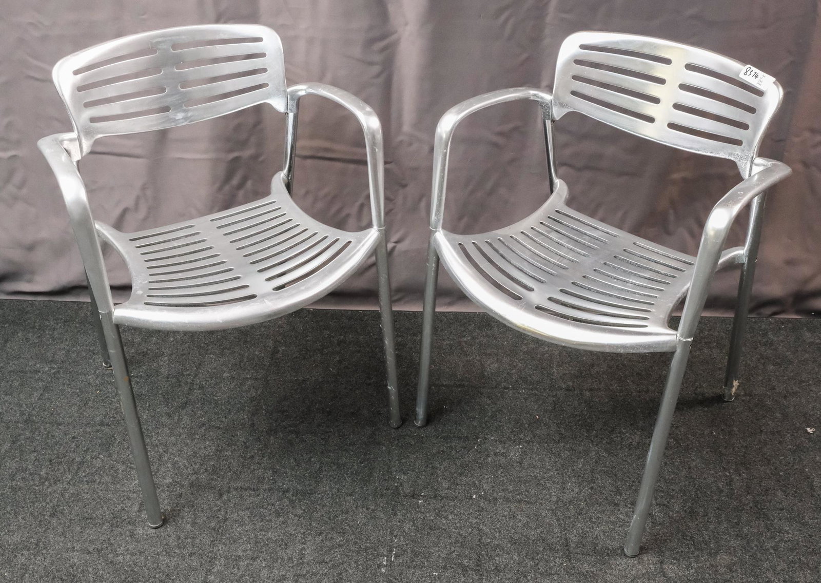 Pair of Jorge Pensi "Toledo" Chairs: Pair of Jorge Pensi for Amat (for Knoll) cast-aluminum "Toledo" stacking chairs, stamped "Toledo Design Jorge Pensi for Amat, Made in Spain" on the bottom, circa 1986, 30 1/2" H x 22" W x 21" D.