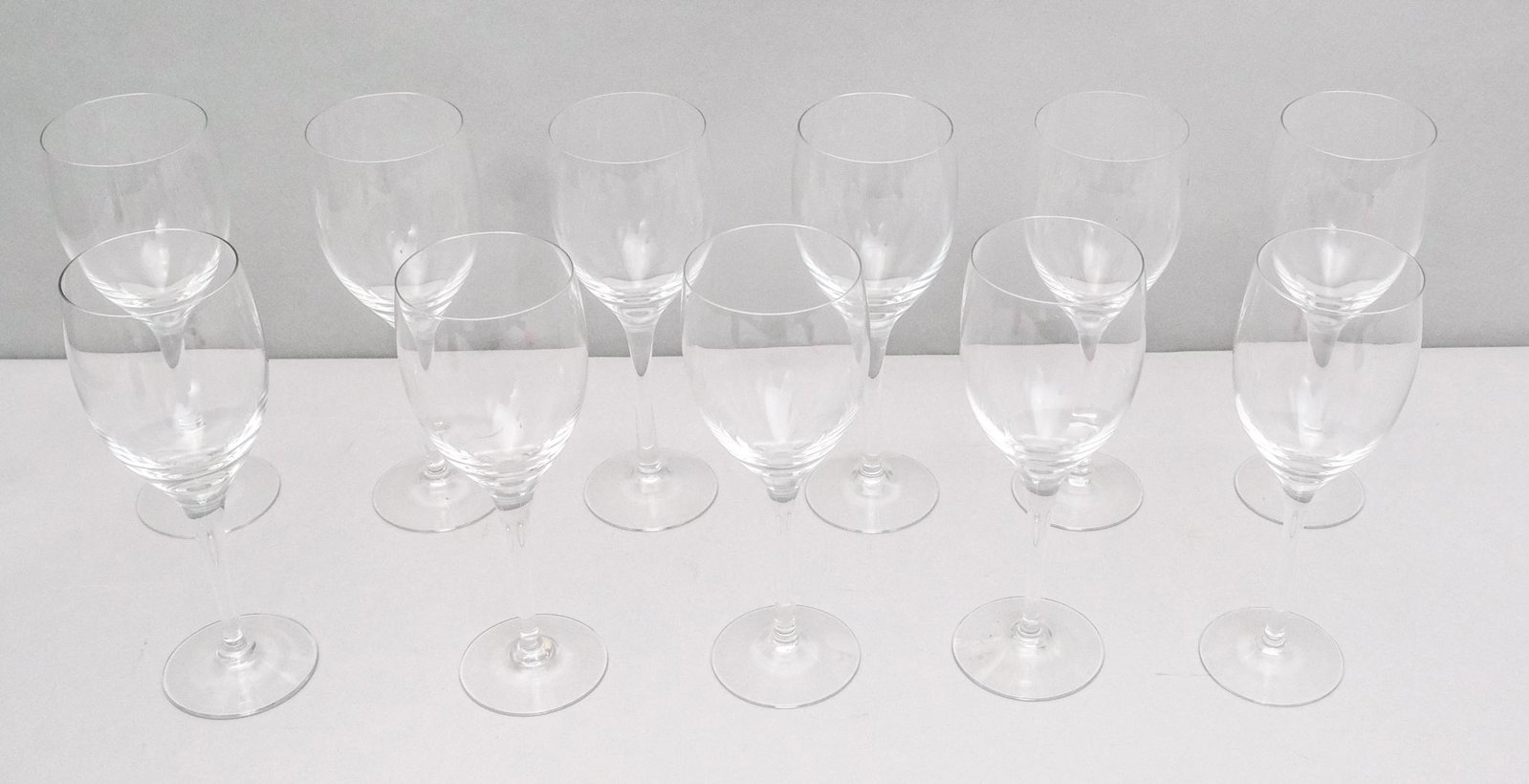Set of Signed Crystal Wine Goblets (11): Set of 11 blown glass stemware in the, marked on the underside, 7 1/2".