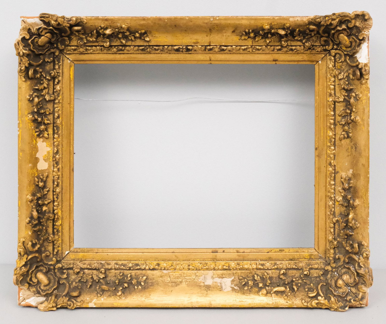 American Baroque Revival Giltwood Frame: American, circa 1840, in the French style. Overall 16 1/2" x 20", rabbet 11" x 15", molding 2 3/4".