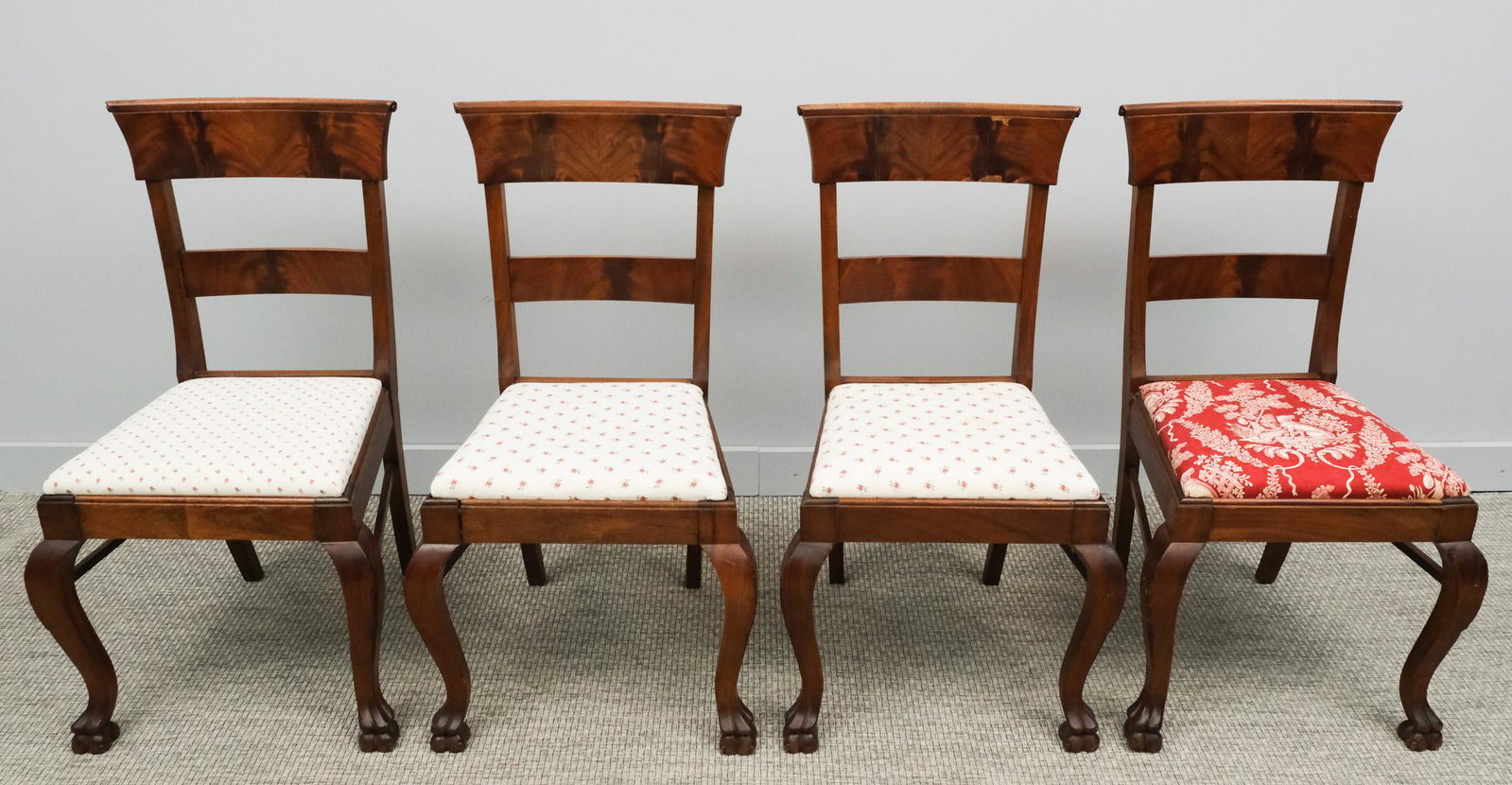 Set of 4 Antique Chippendale Side Chairs: Crotched mahogany backs, drop seats, and claw feet. 16 1/2"L x 20"W x 36 1/2"H.