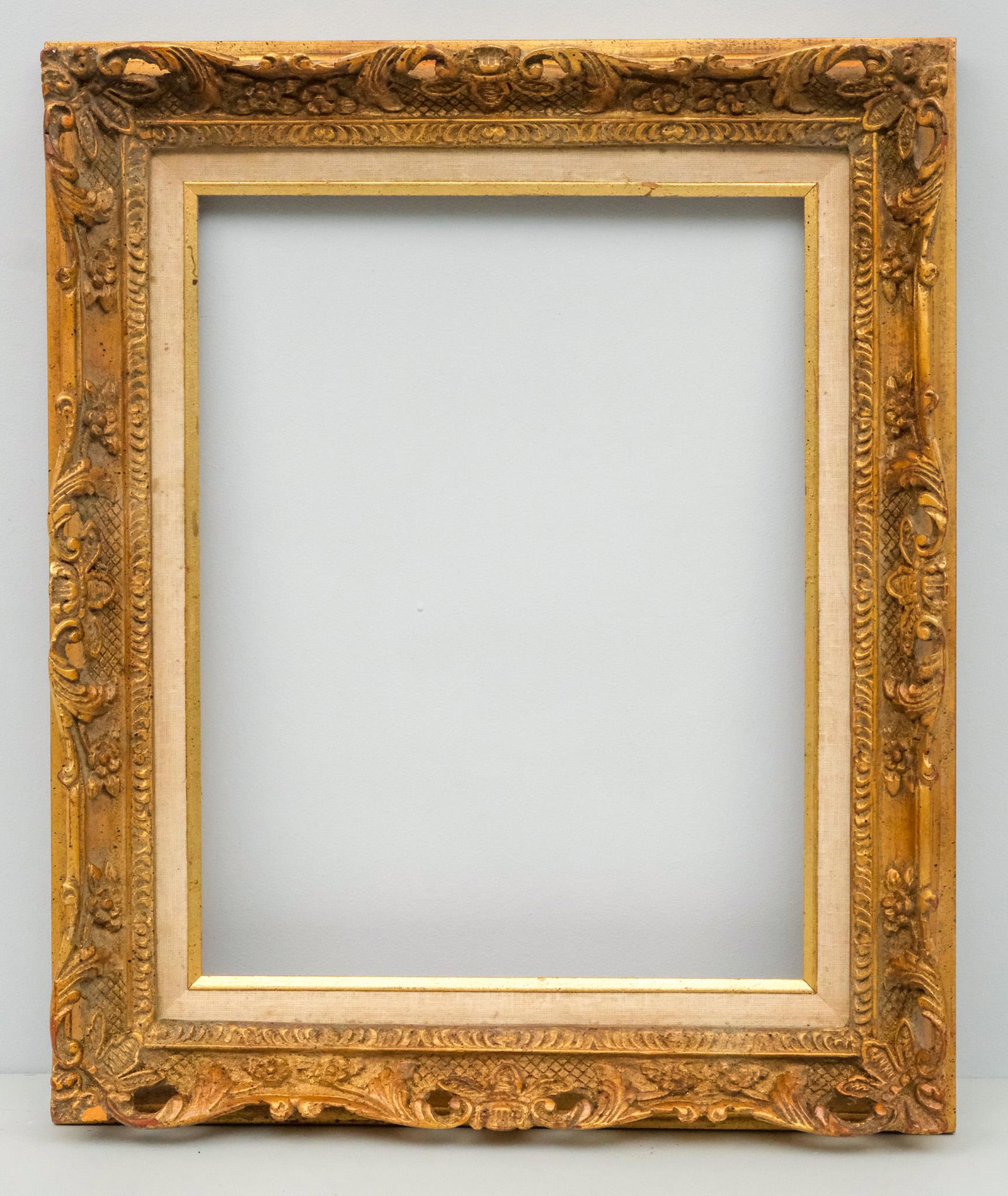 Louis XIV Style Giltwood Frame: American, 20th century, giltwood frame in the French style with openwork top edge. Overall 20" x 24", rabbet 14" x 18", molding 3 1/4".