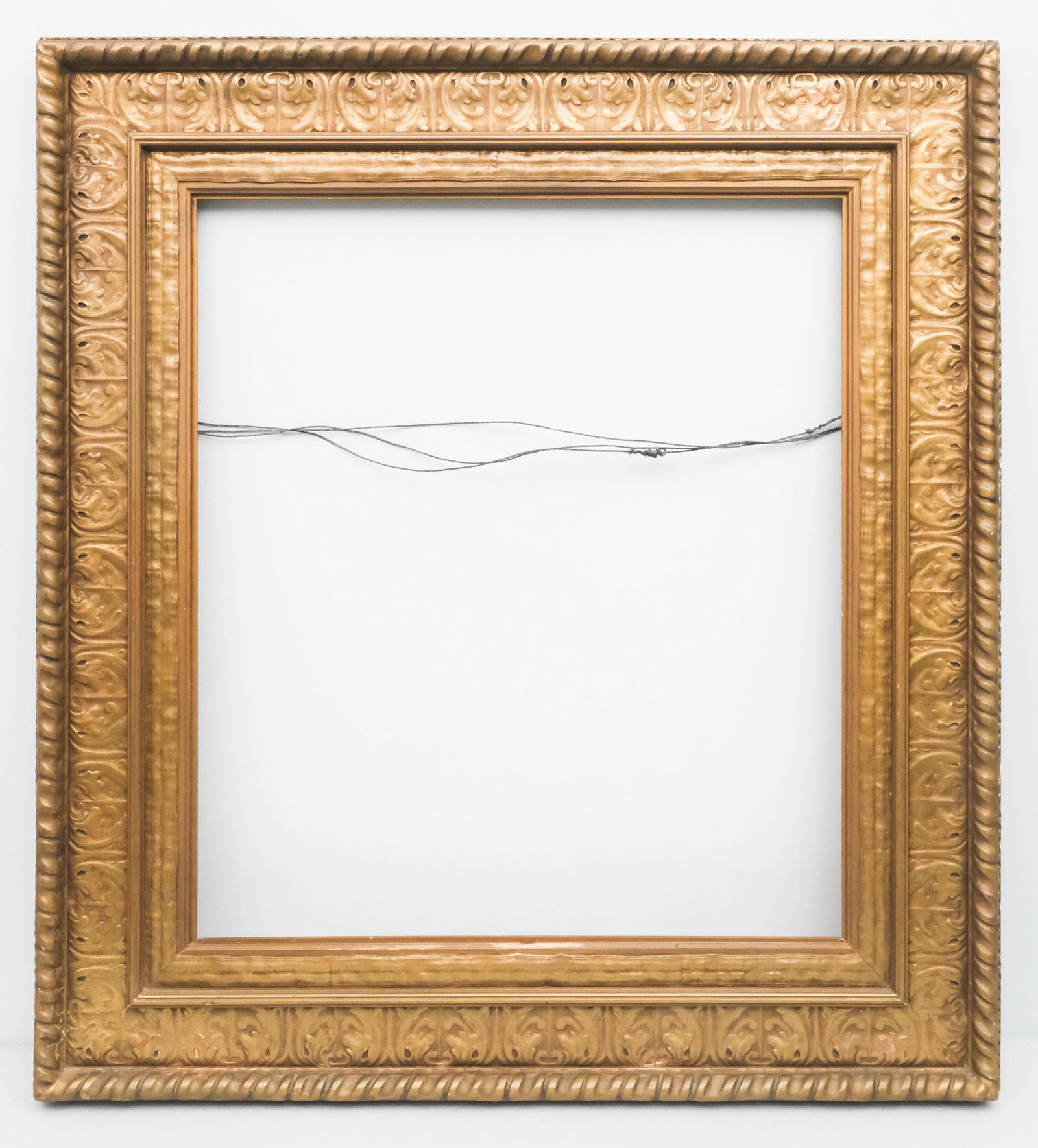 American Arts & Crafts Giltwood Frame: American, 20th century, likely Newcomb Macklin. Overall 39 1/2" x 20", rabbet 27" x 31", molding 6 1/2".