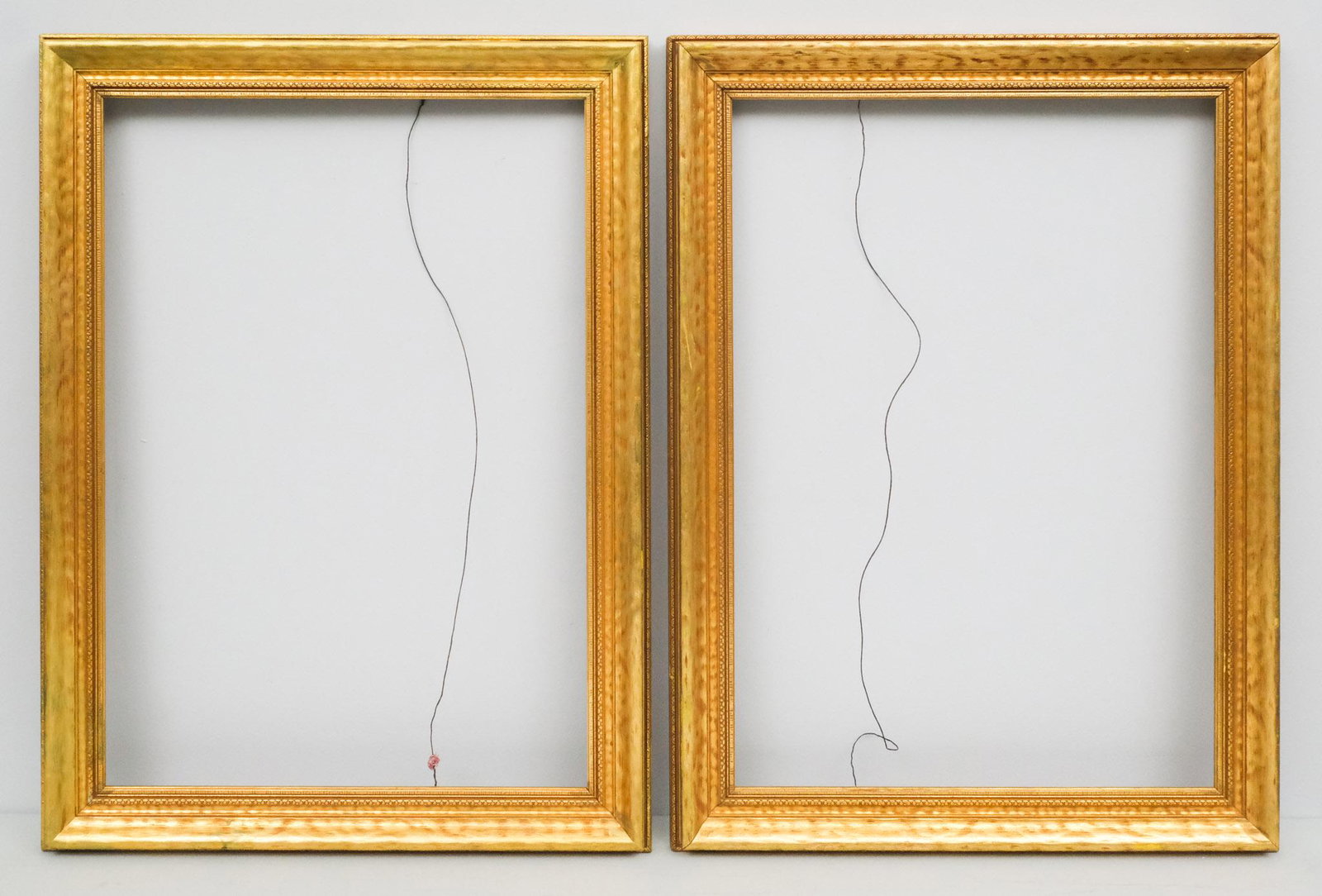 Pair of Arts & Crafts Gilt Frames: American, 20th century,giltwood frames. Overall 23 1/2" x 31 1/2", rabbet 19" x 27", molding 2 1/2".