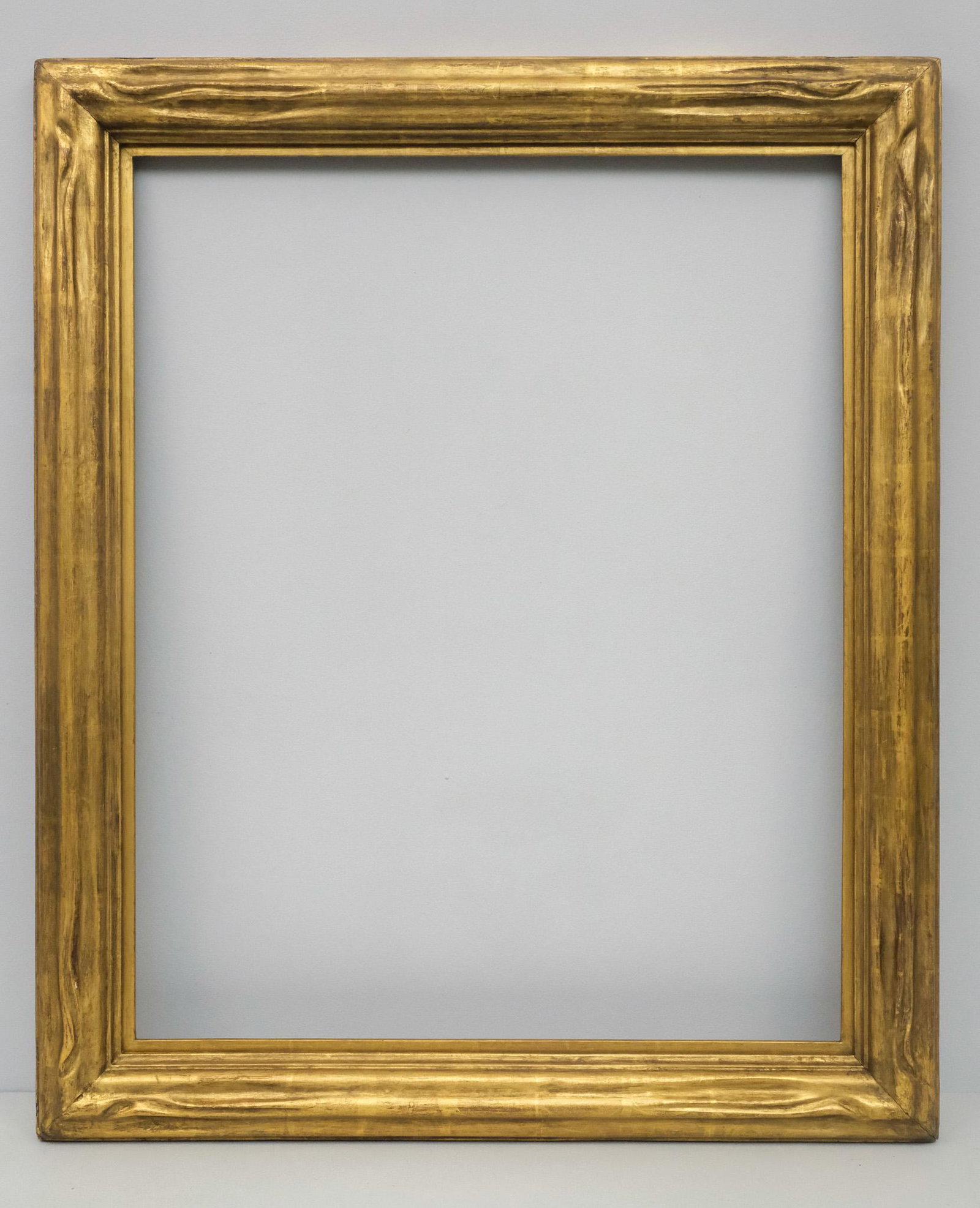 American Arts & Crafts Gilt Frame: American, circa 1920, hand carved and gilded, possibly by Newcomb Macklin. Overall 29 1/2" x 35 1/2", rabbet 24" x 30", molding 3 1/4".