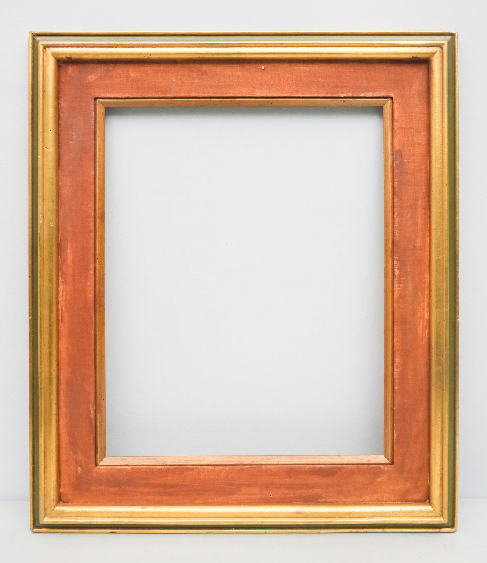 Custom Giltwood Frame: American, 20th century, custom gilt and painted frame with canvas lined panel, in a great standard size. Overall 23 3/4" x 27 3/4", rabbet 16" x 20", molding 4".