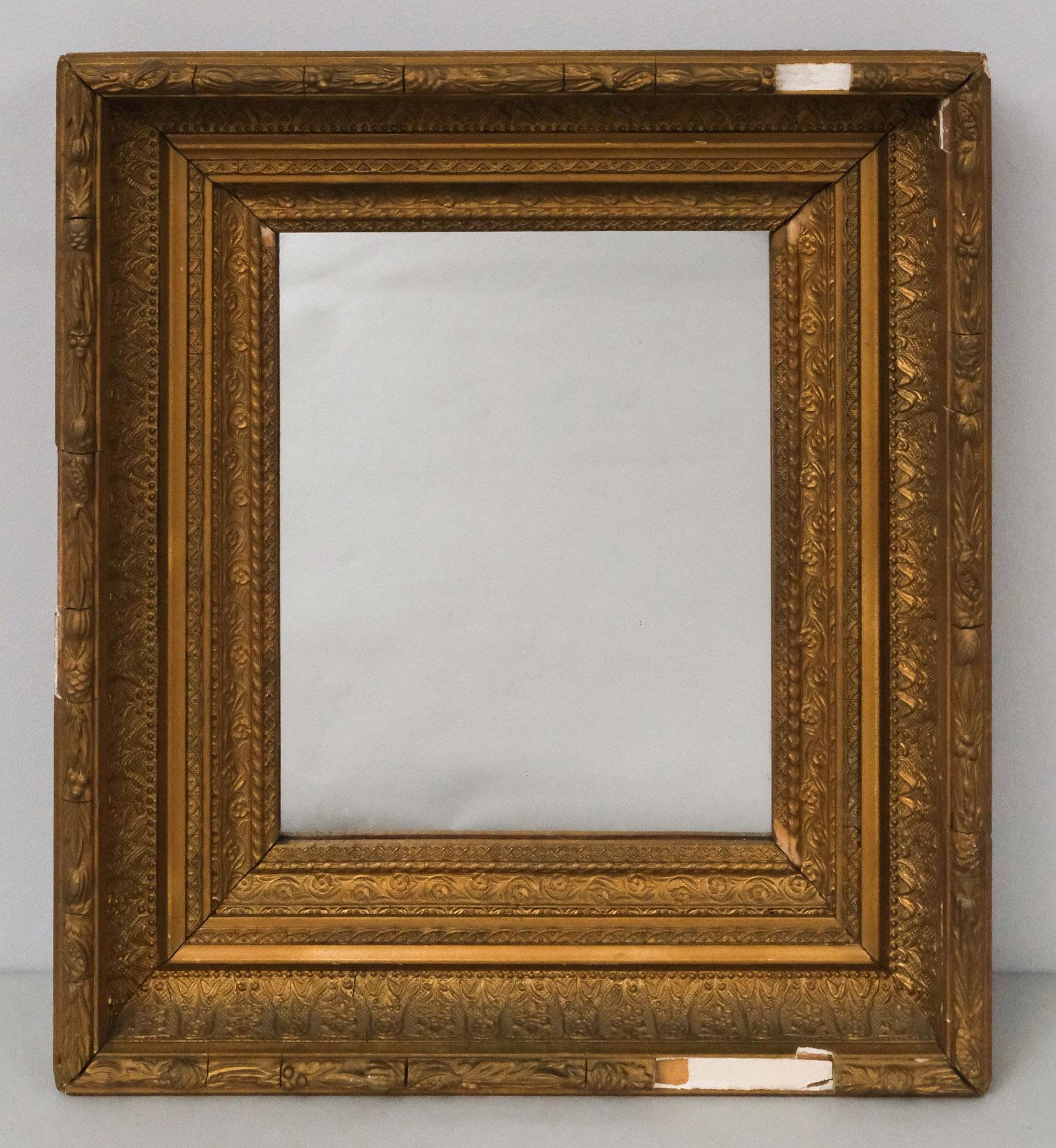 Hudson River School Frame with Mirror: American, circa 1880, having laurel and berry top edge, with mirrored glass, 13 1/2" x 15 1/2" overall.