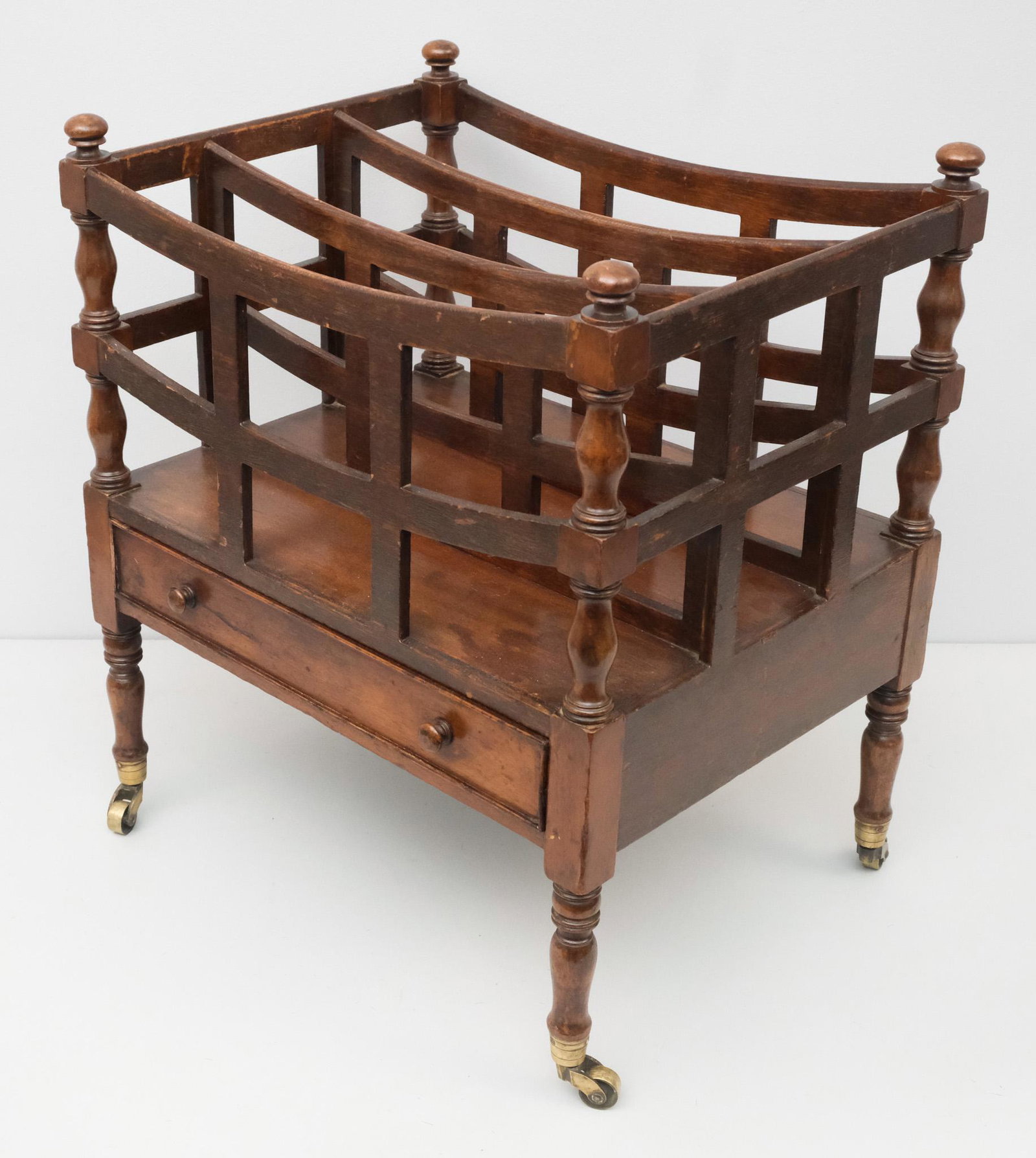 Vintage Canterbury Magazine Rack: 20th century Canterbury magazine rack on castors with single drawer, 20 1/4" H x 17 1/2" W x 13 1/2" L.