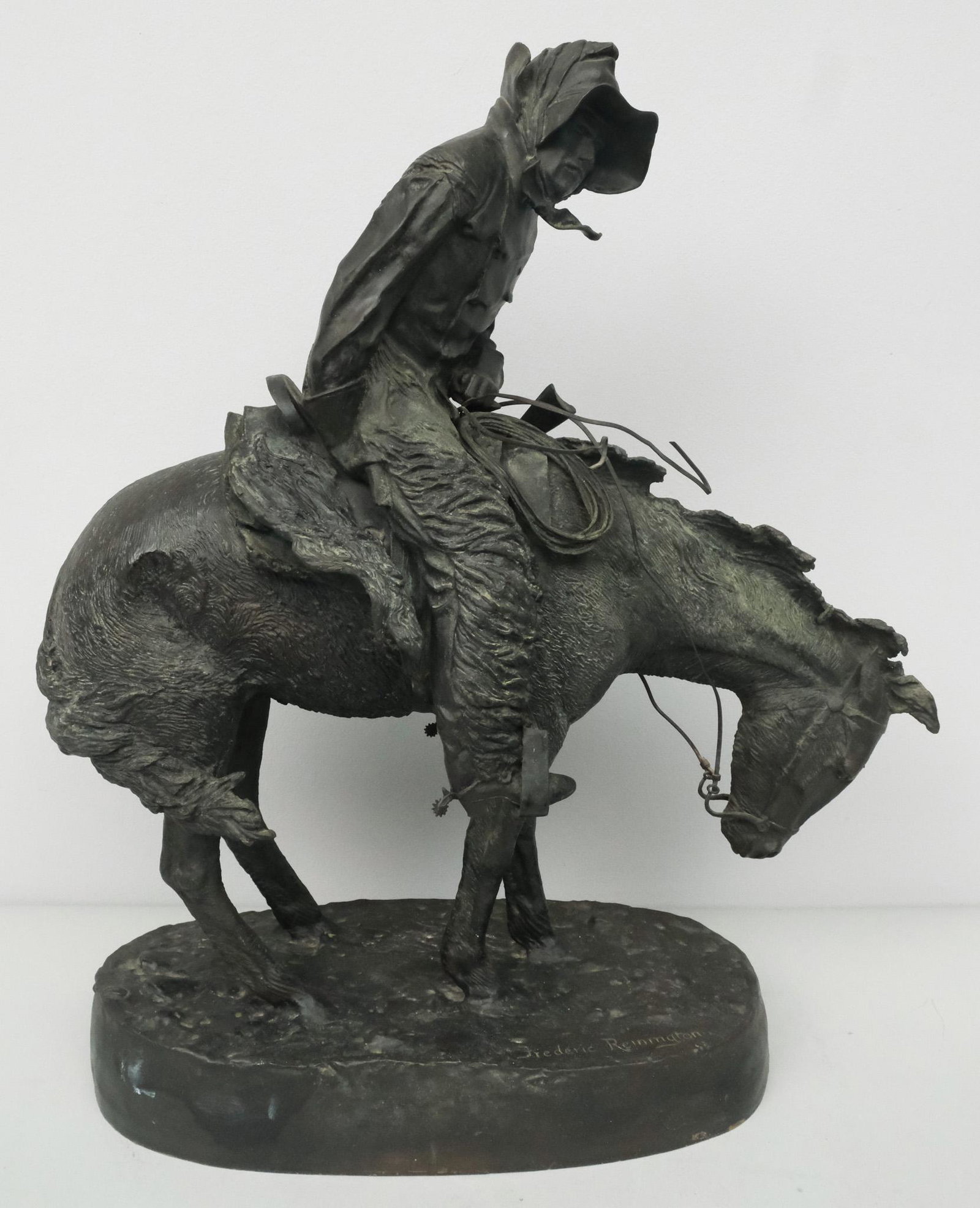 After Frederic Remington, "The Norther": After Frederic Remington (American, 1861-1909), finely cast bronze of windblown horse and rider sculpture, with cast signature on right side of base, 22" H x 14" W x 7" L.