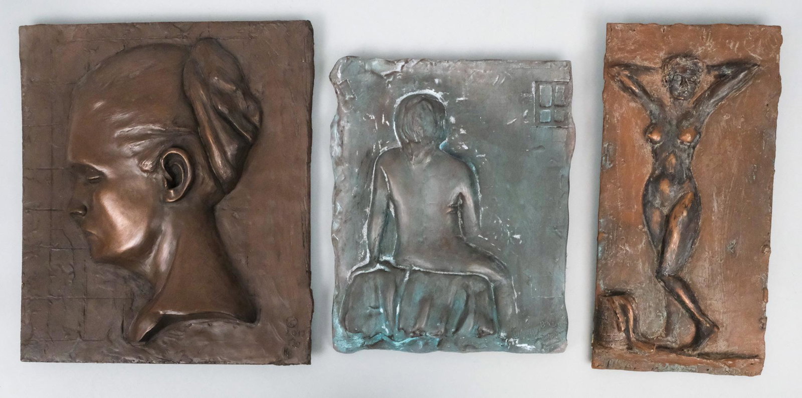 Group of 3 Bronzed Plaques: Group of three plaques finished in bronze from Atelier Ball studios, including "Penelope", 2017, a plaque depicting a woman's face in profile, hair pulled up, 10 1/2" x 12" overall; a plaque depicting