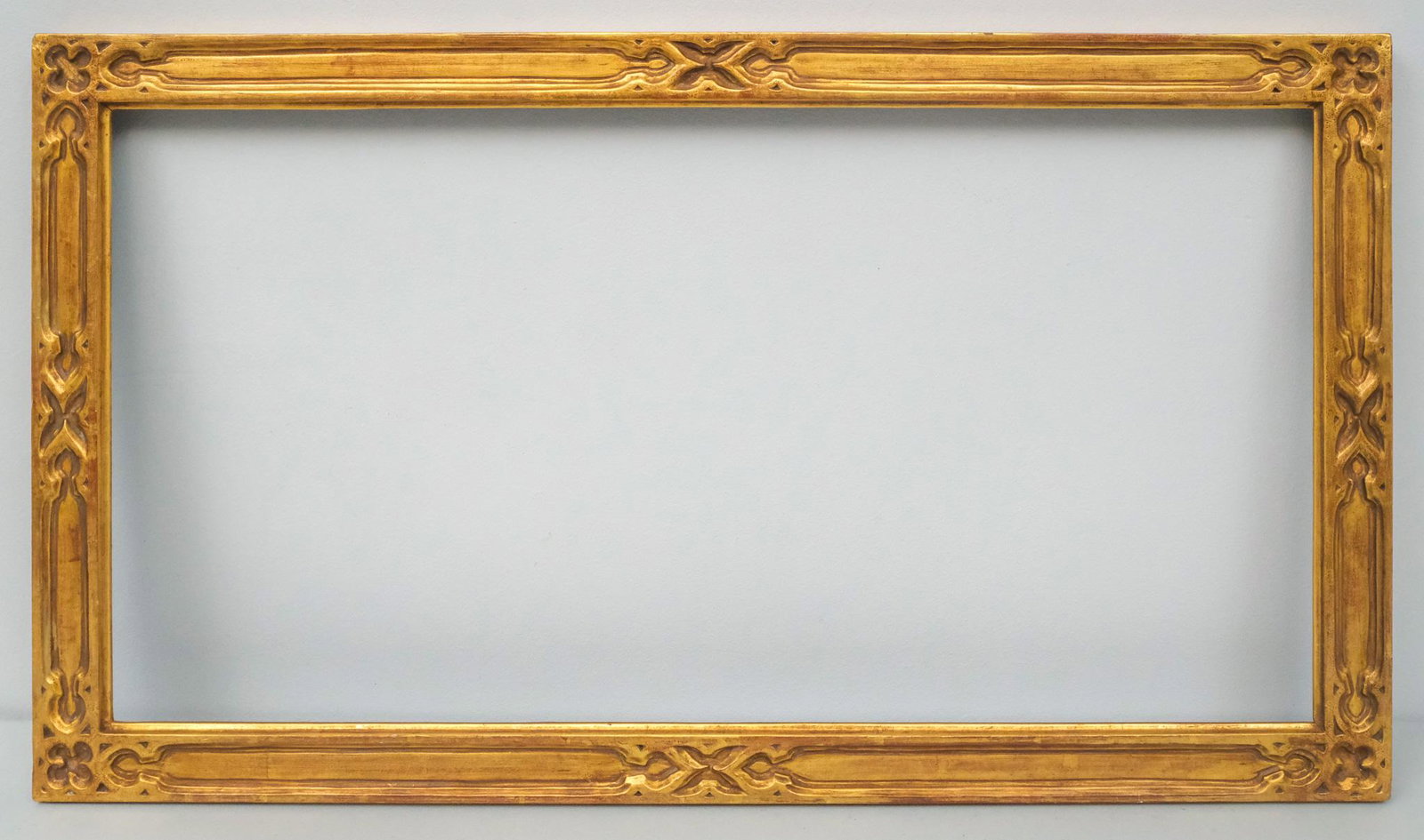 American Arts & Crafts Gilt Frame: American, circa 1920, likely by Foster Bros., carved and gilded cassetta profile. Overall 15 1/4" x 27", rabbet 12 1/2" x 24" x molding 1 1/2".