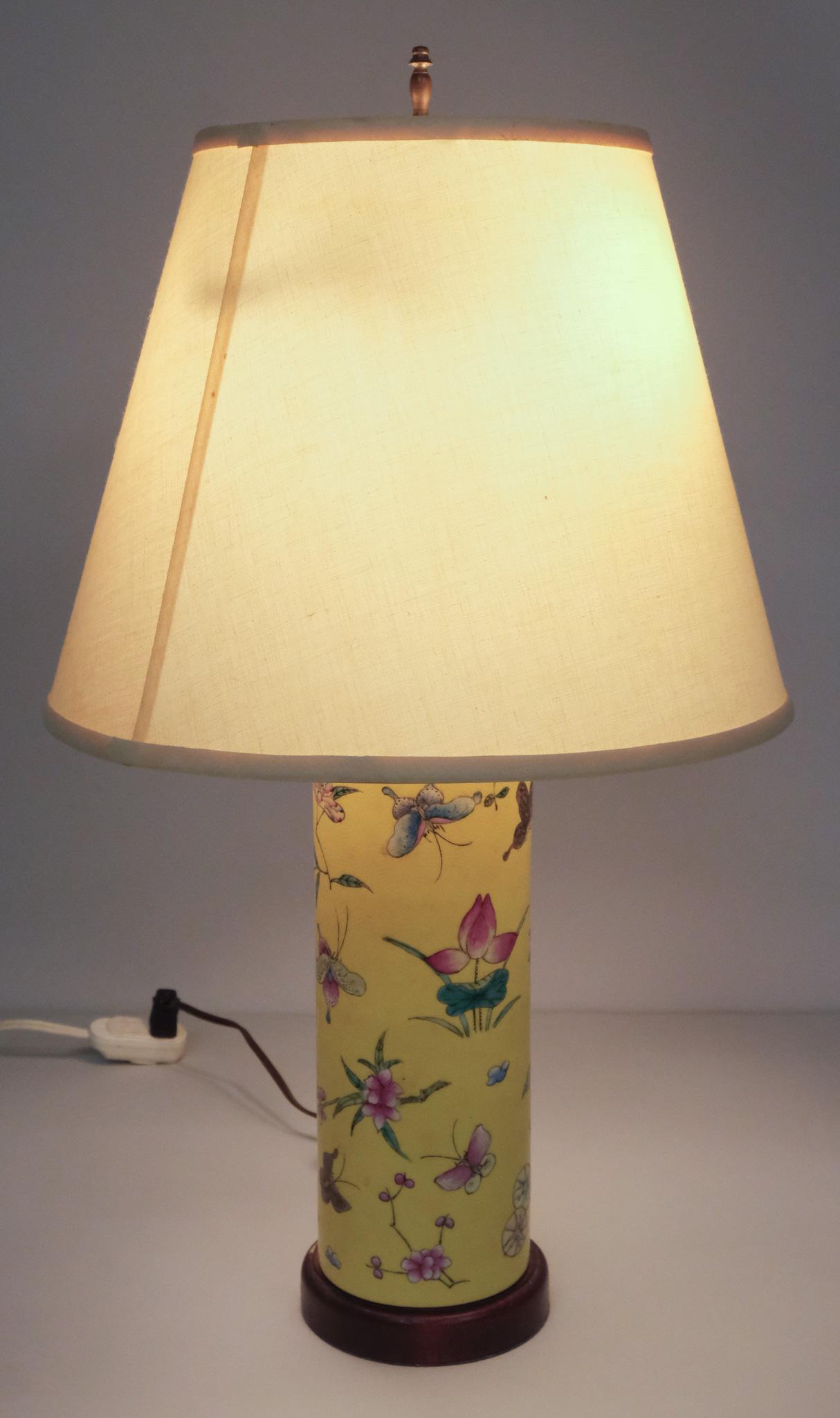 Chinese Porcelain Yellow Cylinder Vase Lamp: Antique Chinese cylinder vase in famille jaune palette. Incised decoration with butterflies and chrysanthemums. 24 1/2 to top of harp.