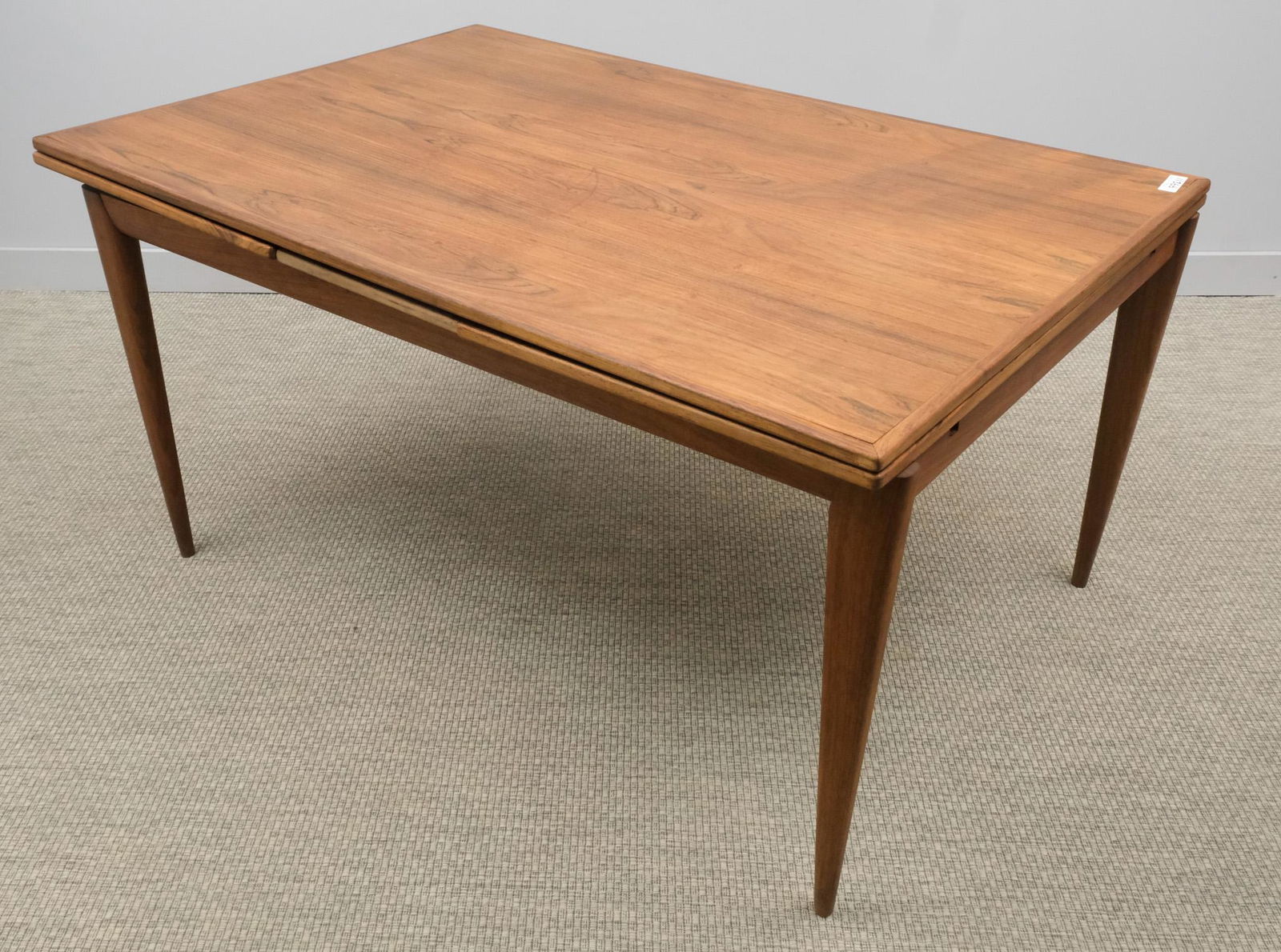Moller Danish Modern Table: Danish, late 20th century dining table with two leaf extensions, 29 1/4" H x 59" W x 40" L. Marked with Moller Sticker as shown.