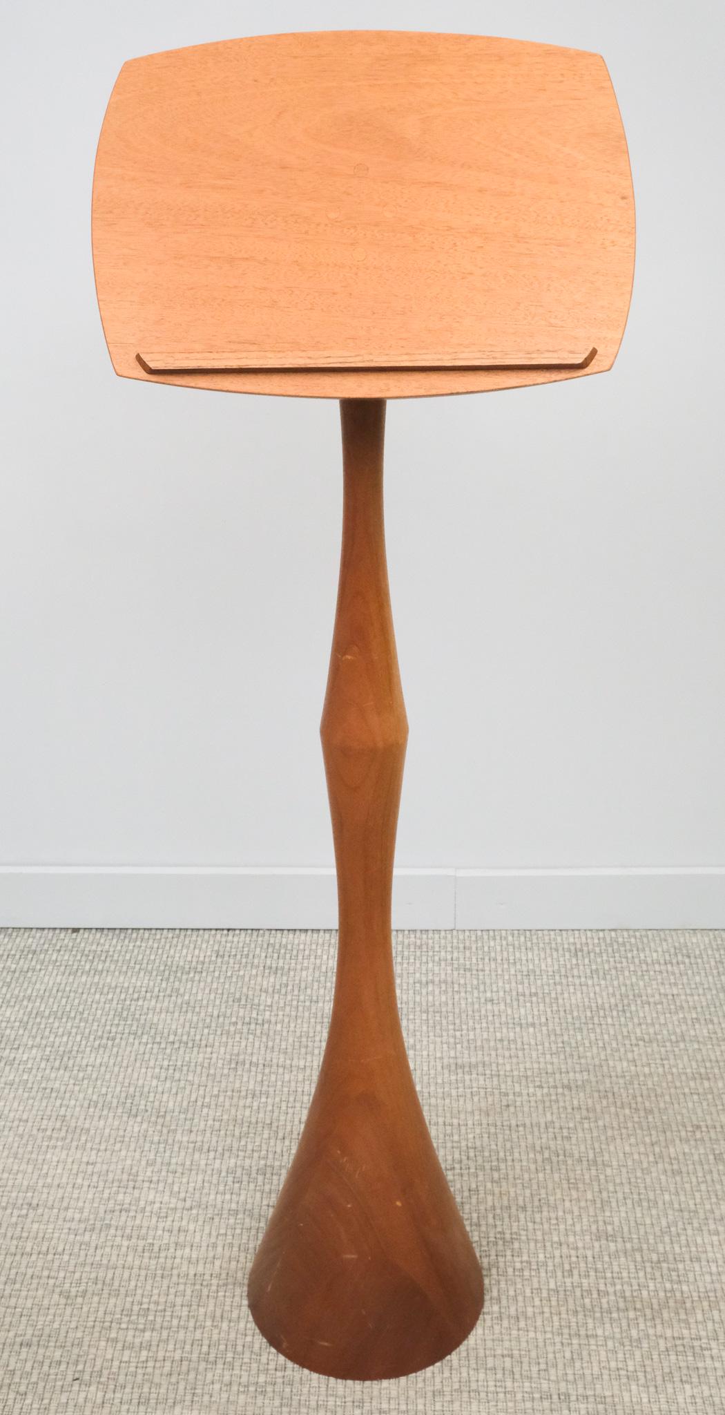 Danish Modern Teak Lectern: Mid-century modern teak lectern with alternately tapered stem, heavy base, good height, 56 1/2" H x 19" W x 11" L.