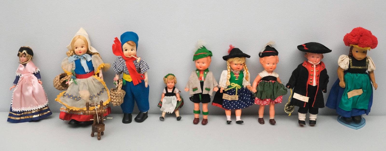 Group of International Dolls, Mostly German: Group of mostly German dolls as well as a Dutch girl and boy pair. One German doll boy has original label reading:"Zwilling-fox trachten puppen Gutacher Bauer, Schwartzwald No. 9 Jorg". Tallest doll m
