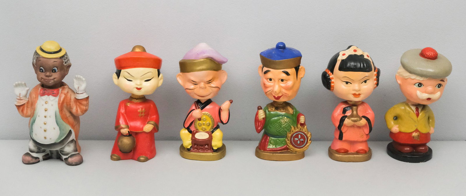 Mid-Century Bobblehead or Nodder Dolls: 4 Asian and one Scottish bobblehead dolls along with a Black Lenwile Ardalt bobblehead. All made in Japan. All dolls measure approximately 5 1/2" high.