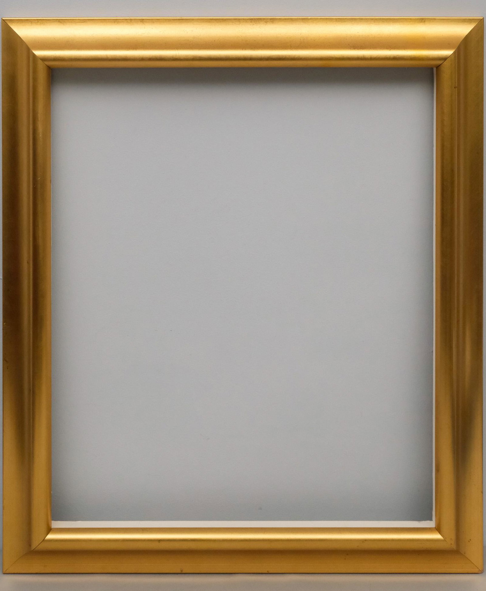 American Giltwood Frame: American, 20th century, custom frame with reverse profile. Overall 29 1/4" x 25 1/4", rabbet 24" x 20", molding 2 3/4".
