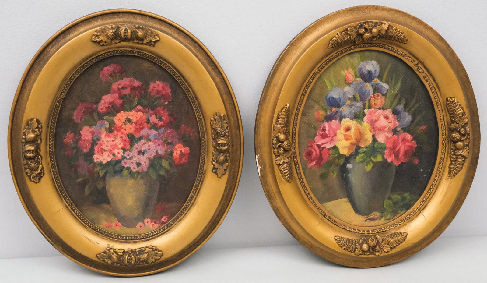 American School, Pair of Floral Arrangements: American, pair of 20th century oil on canvas board depicting two floral arrangements, 10" x 8" board, 14" x 12" framed.