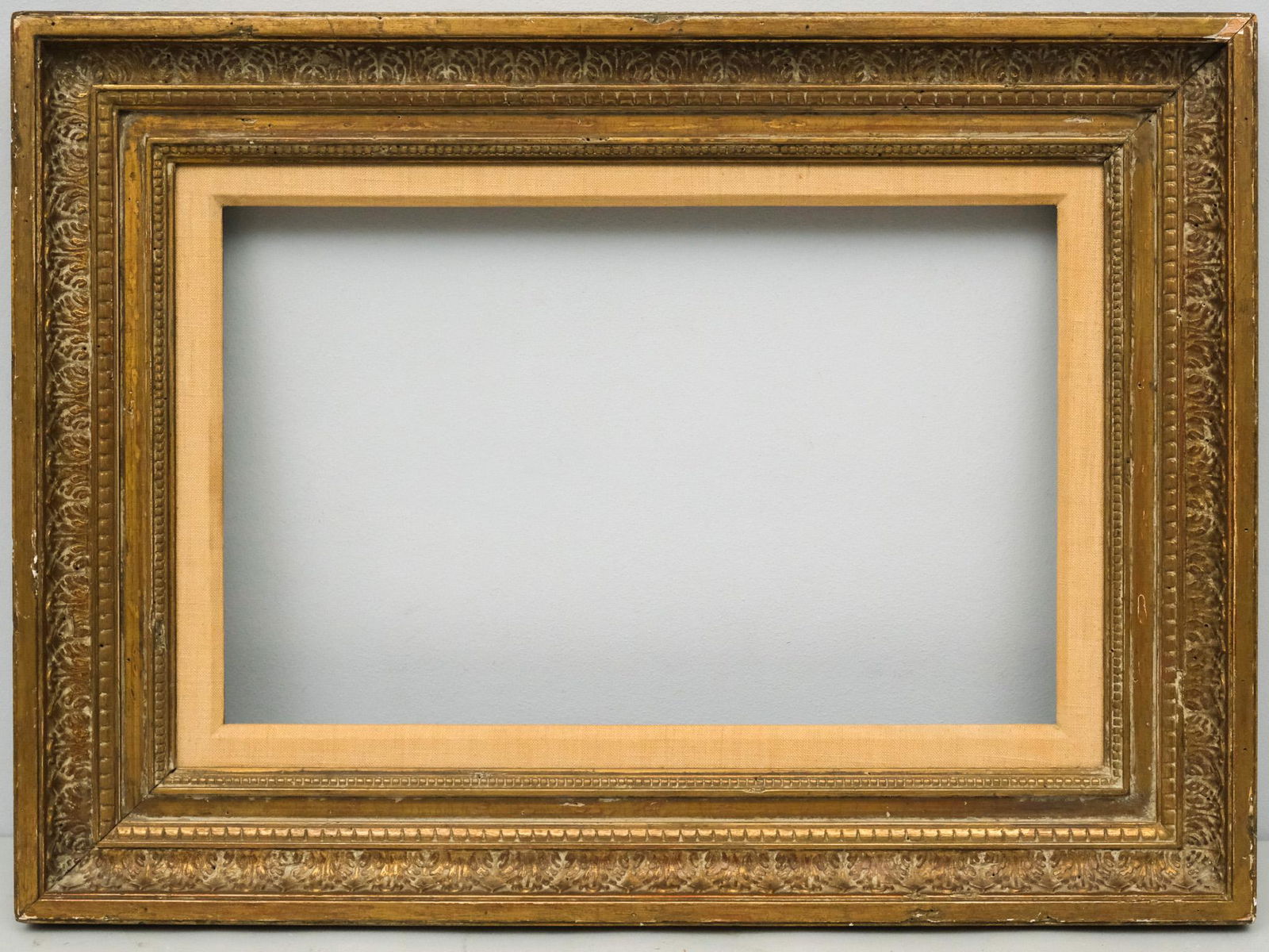 French Empire Giltwood Frame 10" x 16": French, ca. 1820, having gesso scumbling and linen liner. Overall 17" x 23", Rabbet 10" x 16", Molding 3 1/2"