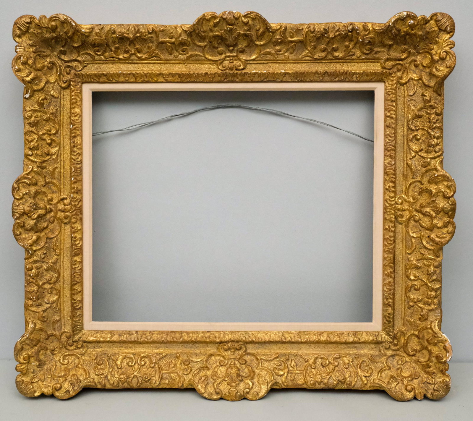 Louis XIV Giltwood Frame 18" x 22": American, 20th century, a very finely wrought custom Louis XIV style carved frame. Overall 28" x 32", Rabbet 18" x 22", Molding 5"