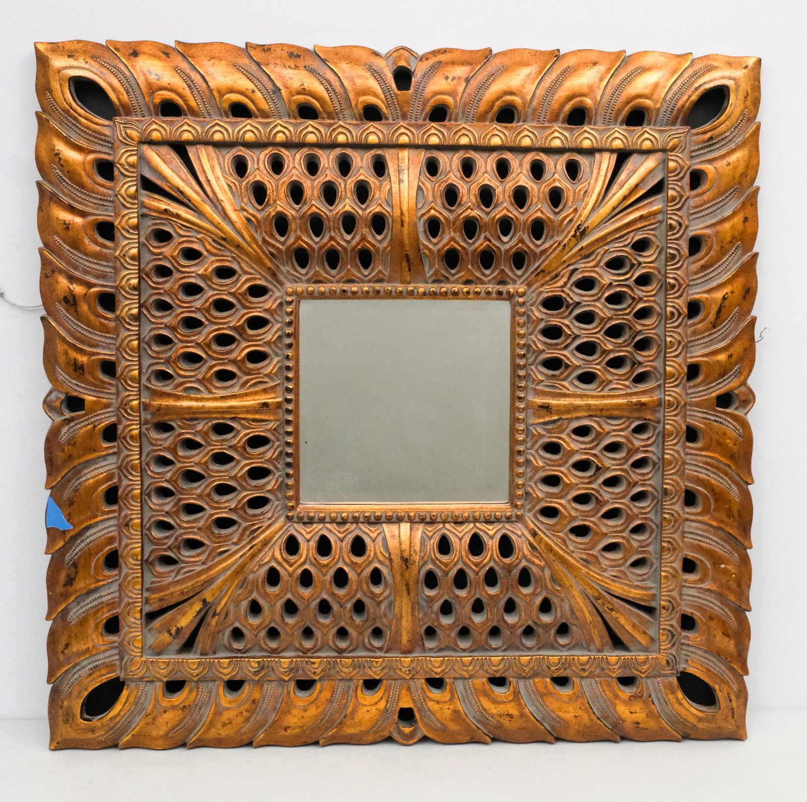 Moorish Style Mirror: 20th century Moorish style resin wall hanging mirror, 38 1/2" x 38 1/2" overall.