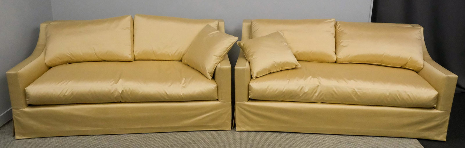 Pair of Cream-Colored Down Couches: Pair of cream-colored, silky down-filled three seat couches, 33 1/2" H x 72" W x 39" L.