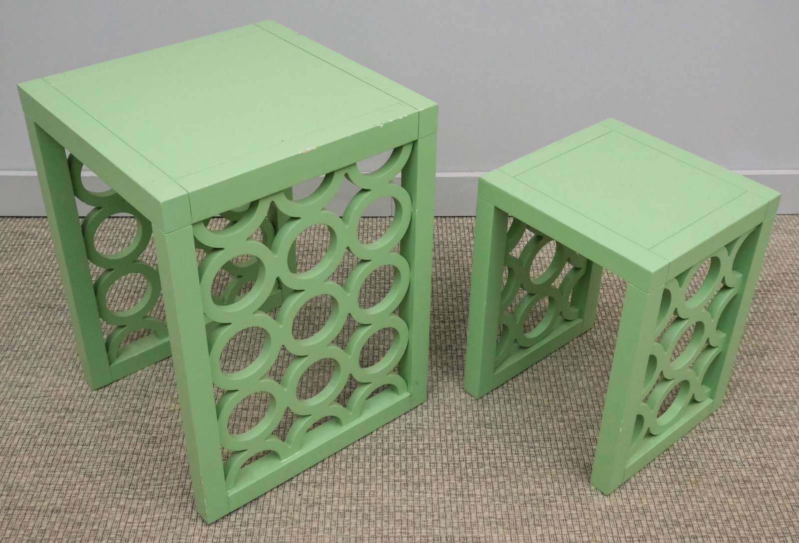 Two Green Nesting Tables: Two mint green nesting tables, larger one 23 1/2" H x 17 1/2" W x 18" L, smaller one 18 1/4" H x 13 1/2" W x 13" L.