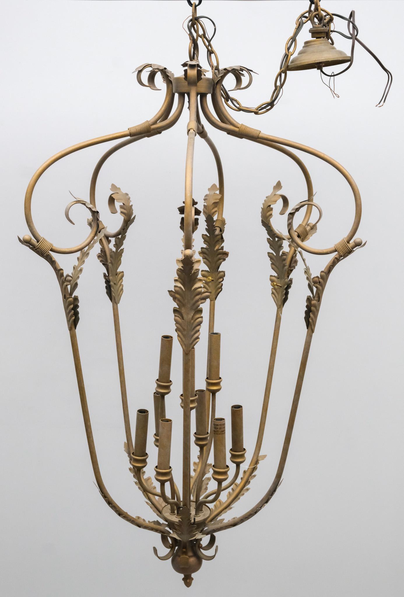 Wrought Metal Chandelier: Wrought metal chandelier with scrolling arms, foliate decorations, wrapped details, and 9 lights, 47" H x 29" diameter.